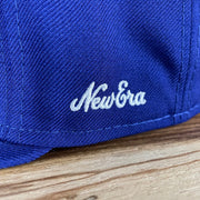 A close up on the 1970s New Era logo on the Los Angeles Dodgers Cooperstown 5950 Day Side Patch Green Bottom 59Fifty Fitted Cap