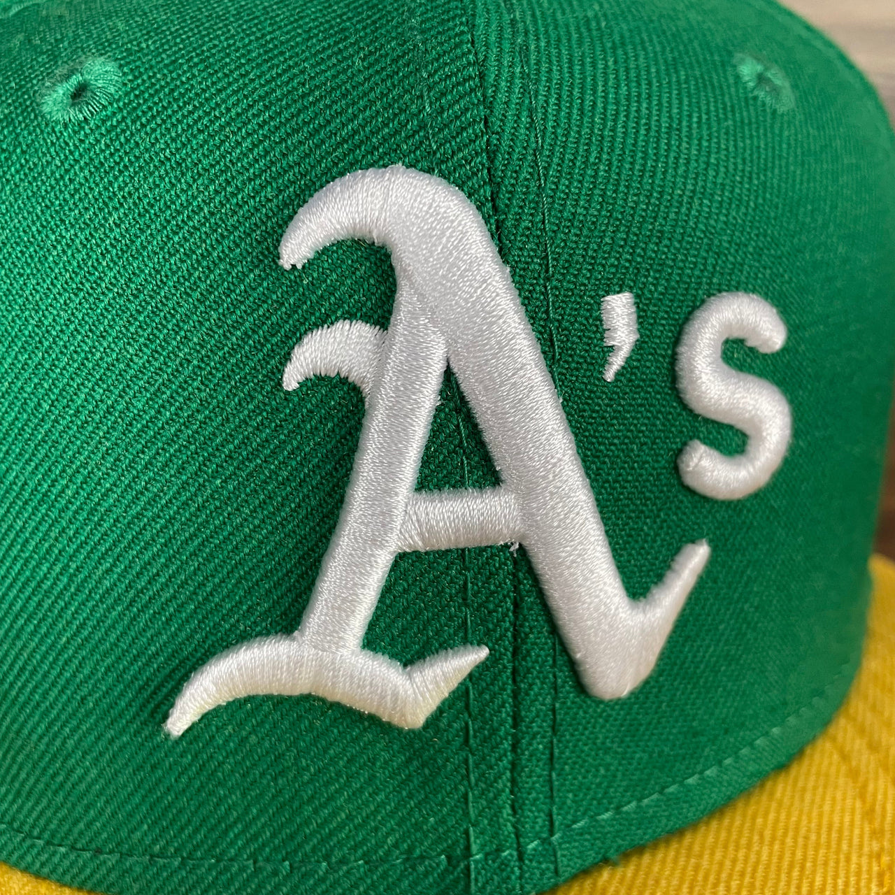 A close up of the Athletics logo on the Oakland Athletics Cooperstown 5950 Day Side Patch Green Bottom 59Fifty Fitted Cap