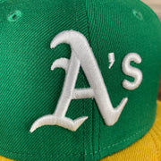 A close up of the Athletics logo on the Oakland Athletics Cooperstown 5950 Day Side Patch Green Bottom 59Fifty Fitted Cap