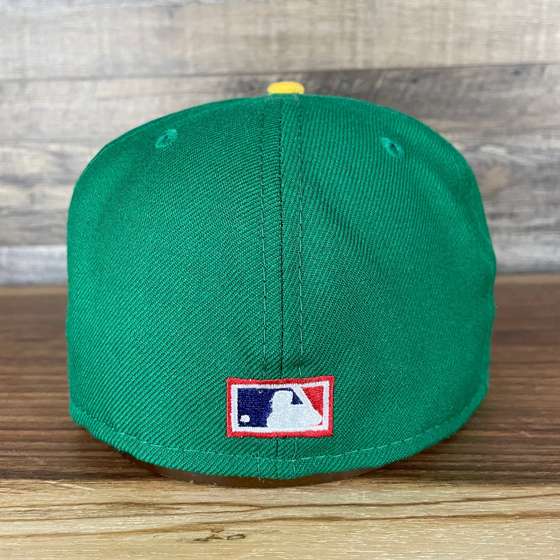 The backside of the Oakland Athletics Cooperstown 5950 Day Side Patch Green Bottom 59Fifty Fitted Cap