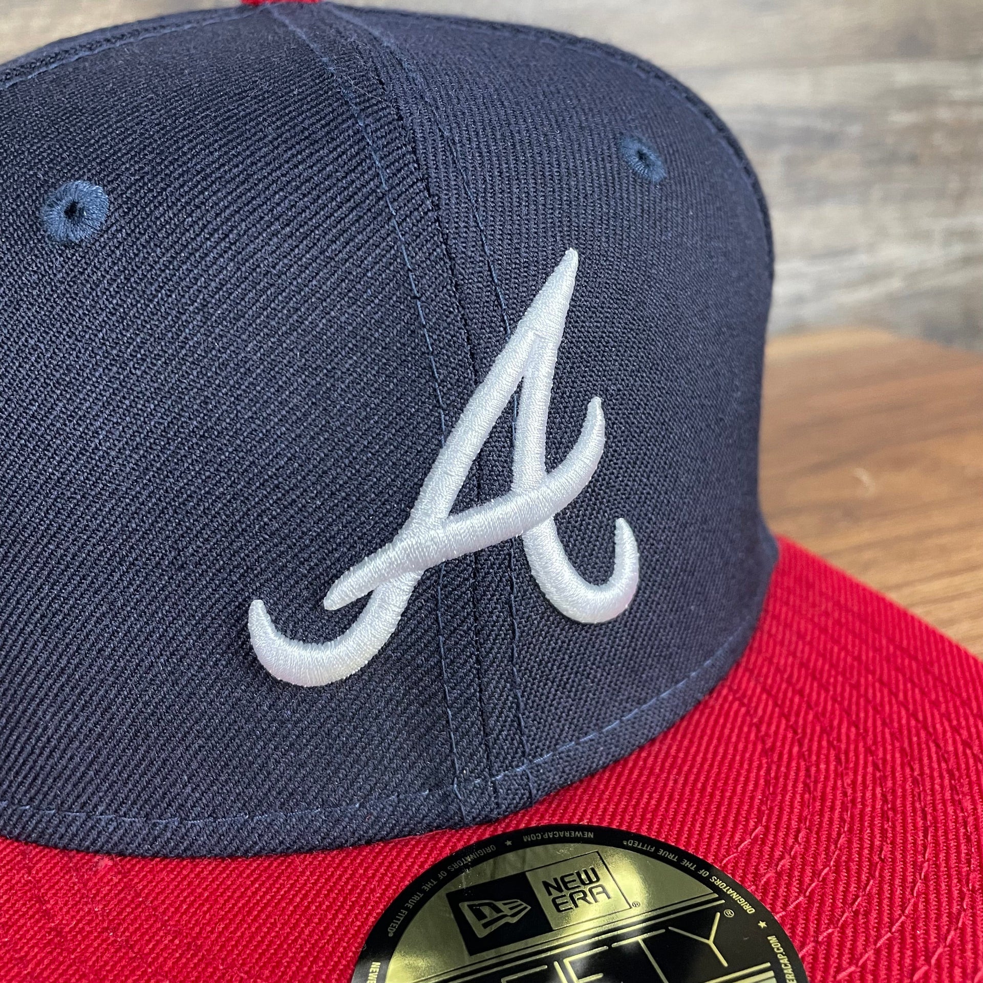 A close up of the Braves logo on the Atlanta Braves Cooperstown 5950 Day Side Patch Gray Bottom 59Fifty Fitted Cap