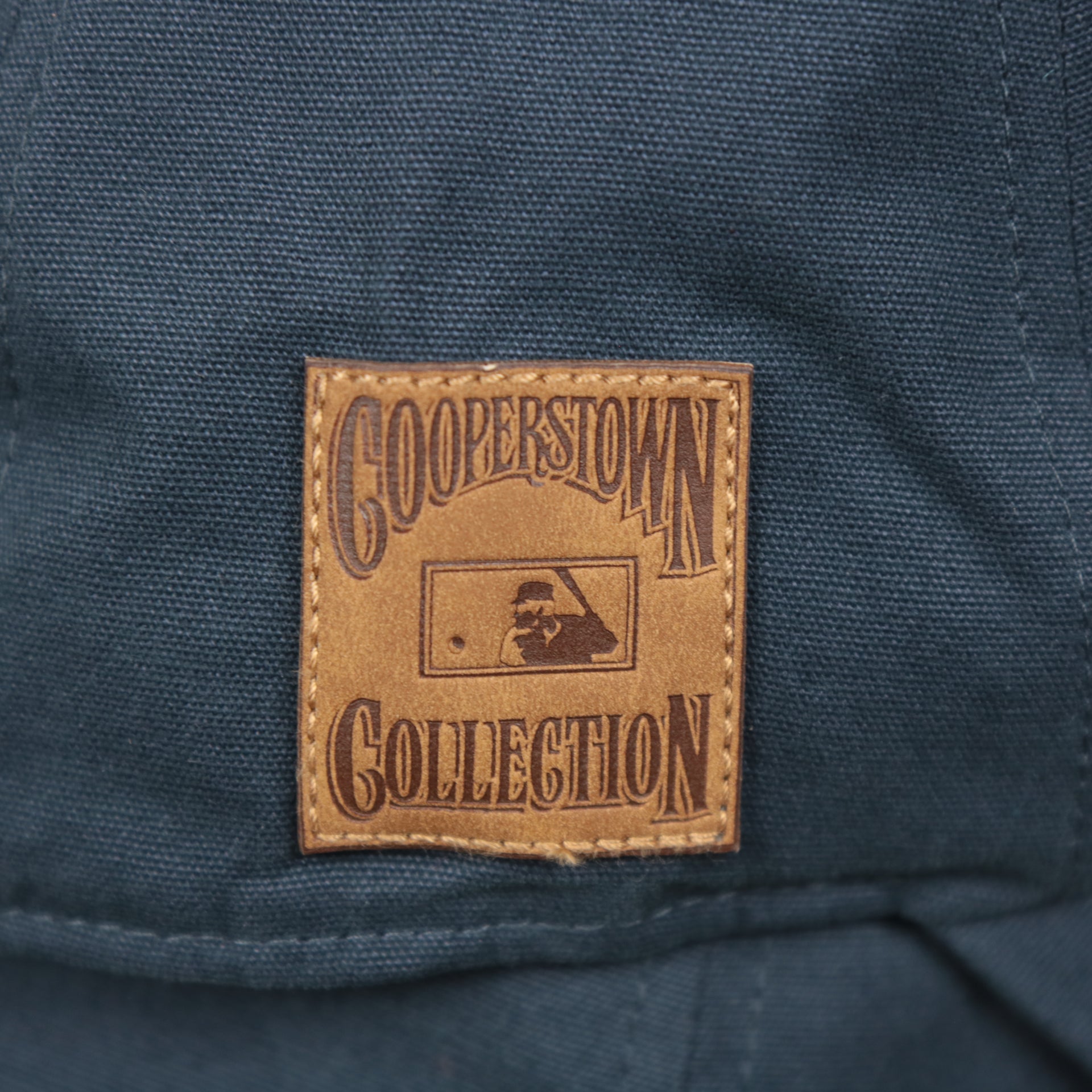 The Cooperstown Collection Patch on the Cooperstown Houston Astros Cooperstown Collection Side Patch Leather Brown Undervisor Dad Hat | Vintage Navy Dad Hat