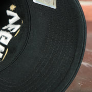 black under visor on the Las Vegas Golden Knights Script Black Dad Hat