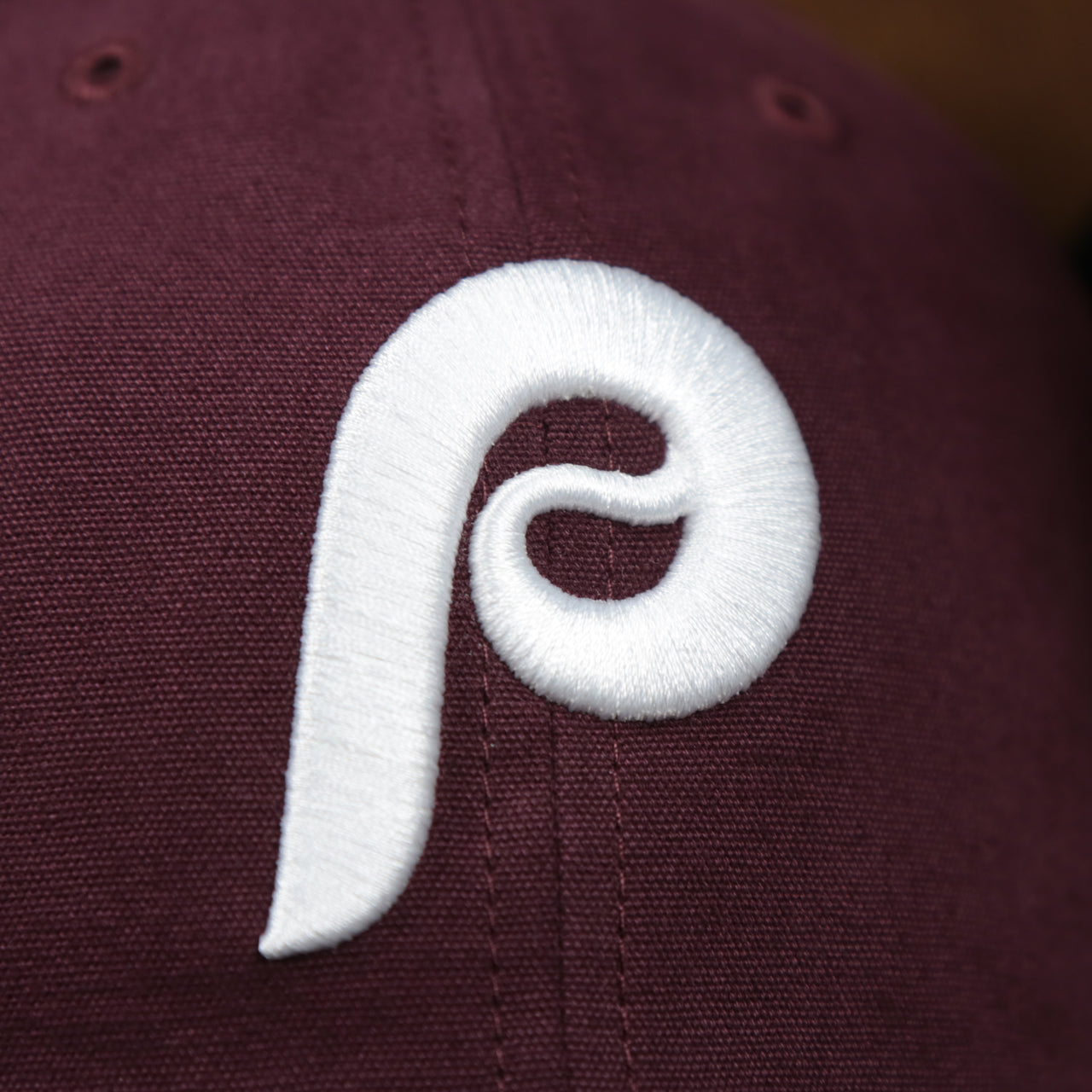 The Cooperstown Phillies Logo on the Cooperstown Philadelphia Phillies Cooperstown Collection Side Patch Leather Brown Undervisor Dad Hat | Maroon Dad Hat