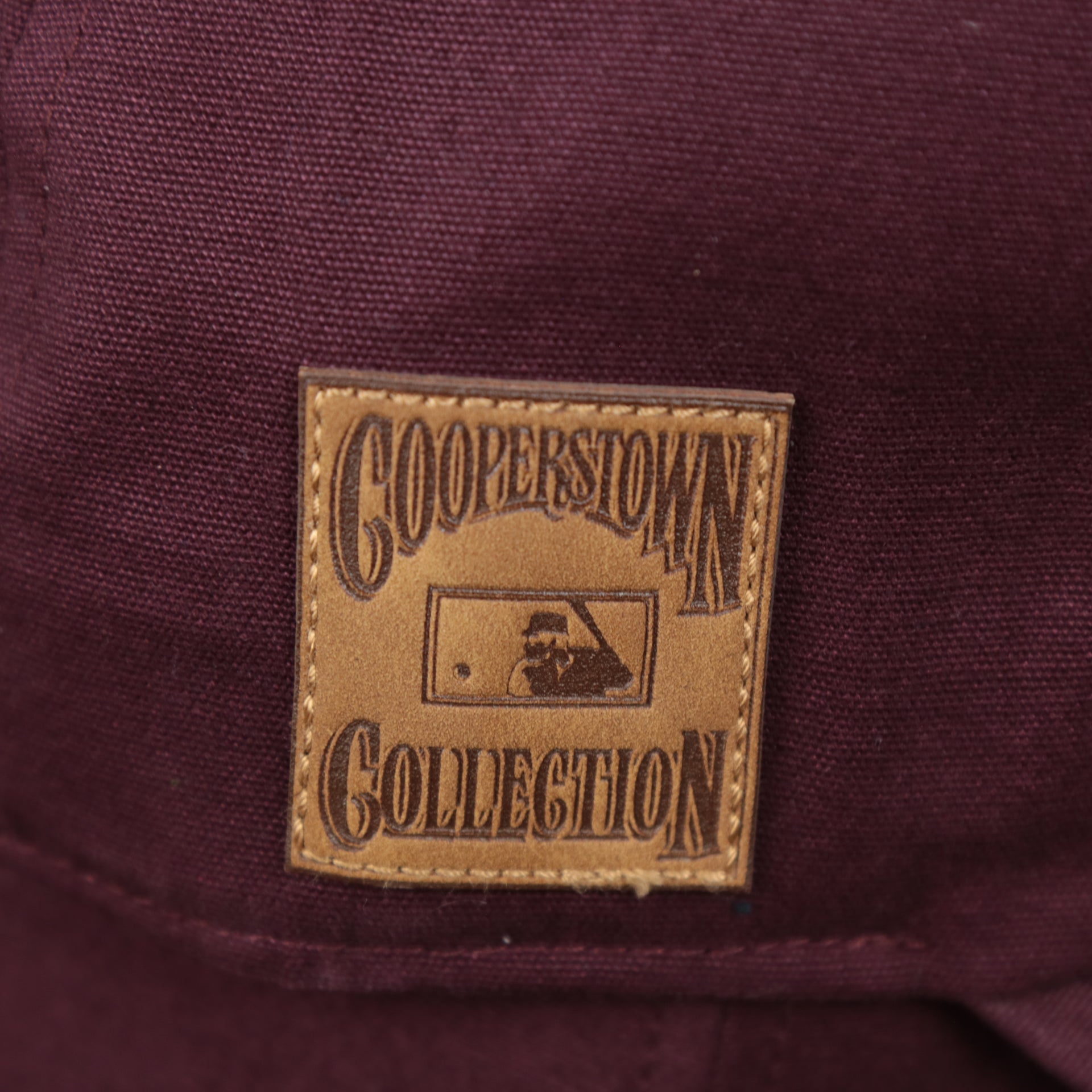 The Cooperstown Collection Leather Patch on the Cooperstown Philadelphia Phillies Cooperstown Collection Side Patch Leather Brown Undervisor Dad Hat | Maroon Dad Hat