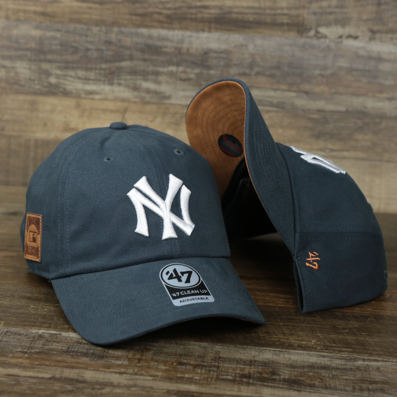 The Cooperstown New York Yankees Cooperstown Collection Side Patch Leather Brown Undervisor Dad Hat | Vintage Navy Dad Hat