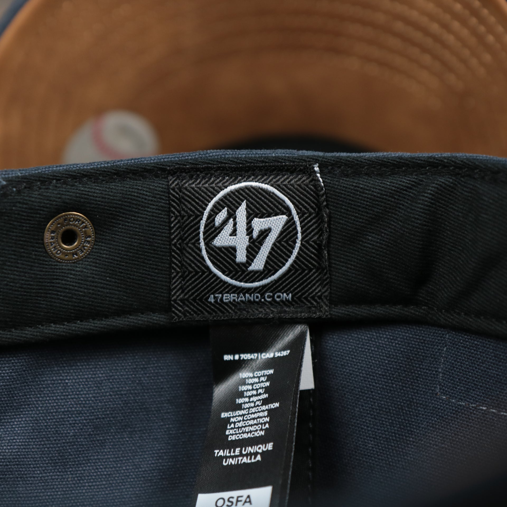 The 47 Brand Tag on the Cooperstown New York Yankees Cooperstown Collection Side Patch Leather Brown Undervisor Dad Hat | Vintage Navy Dad Hat