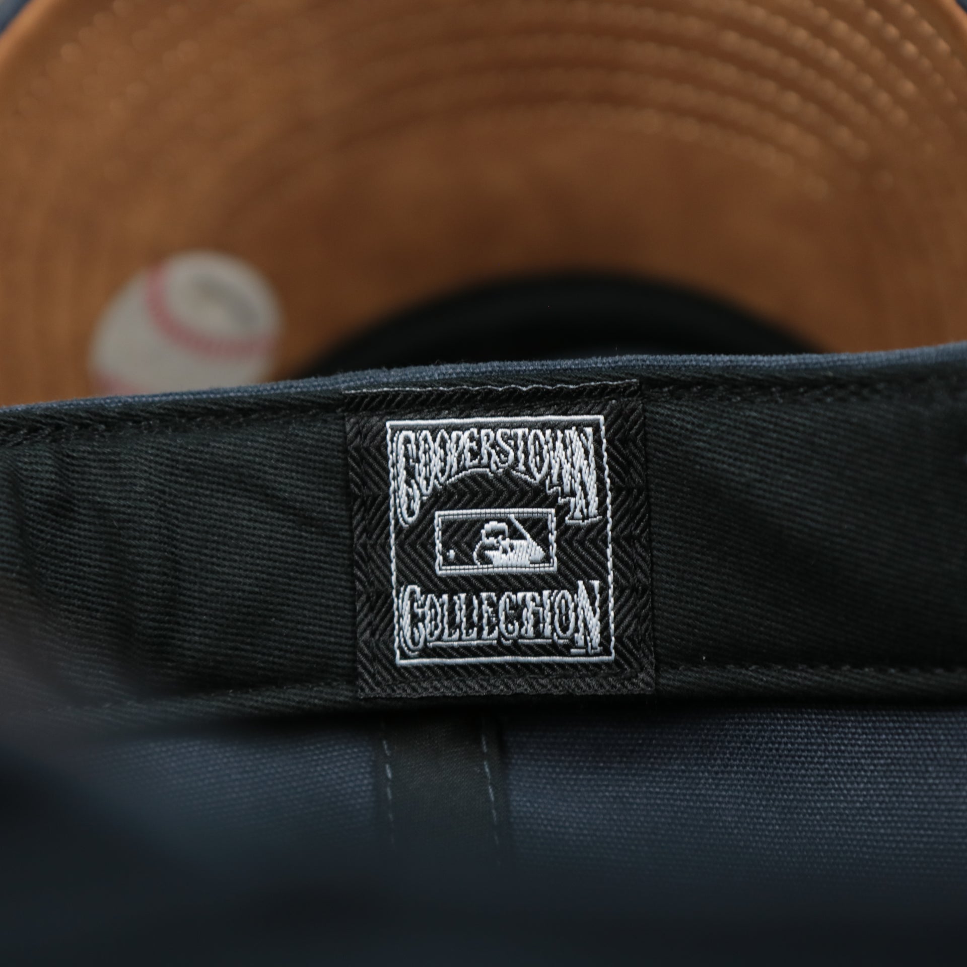The Cooperstown Collection on the Cooperstown New York Yankees Cooperstown Collection Side Patch Leather Brown Undervisor Dad Hat | Vintage Navy Dad Hat