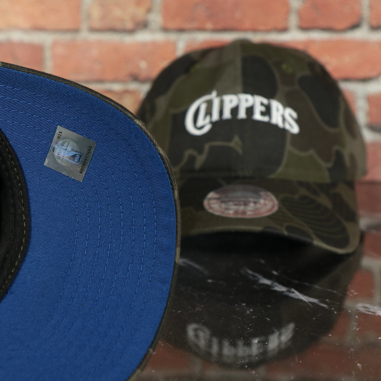 royal blue under visor on the Los Angeles Clippers Woodland Camouflage Mitchell and Ness Dad Hat