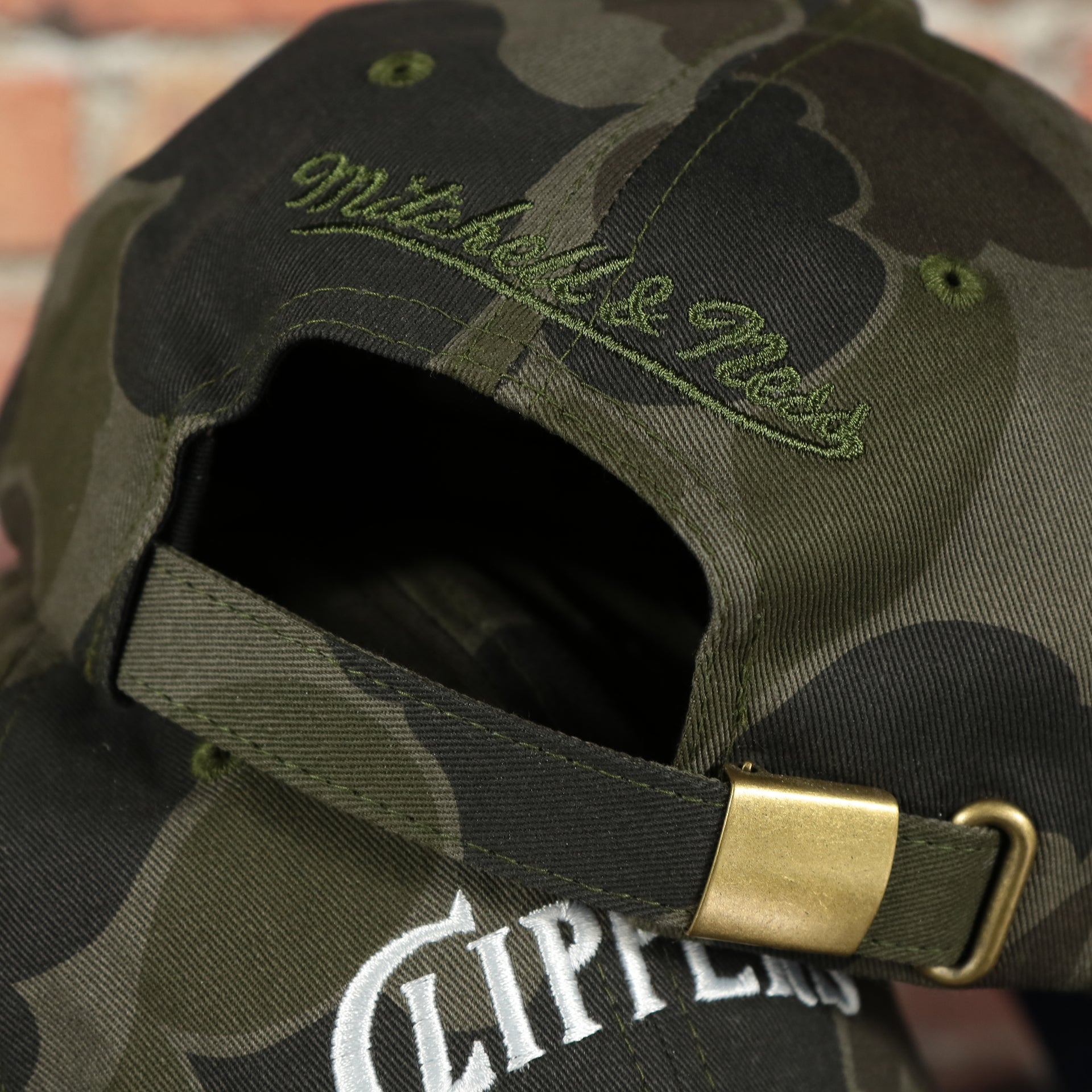mitchell and ness logo on the Los Angeles Clippers Woodland Camouflage Mitchell and Ness Dad Hat