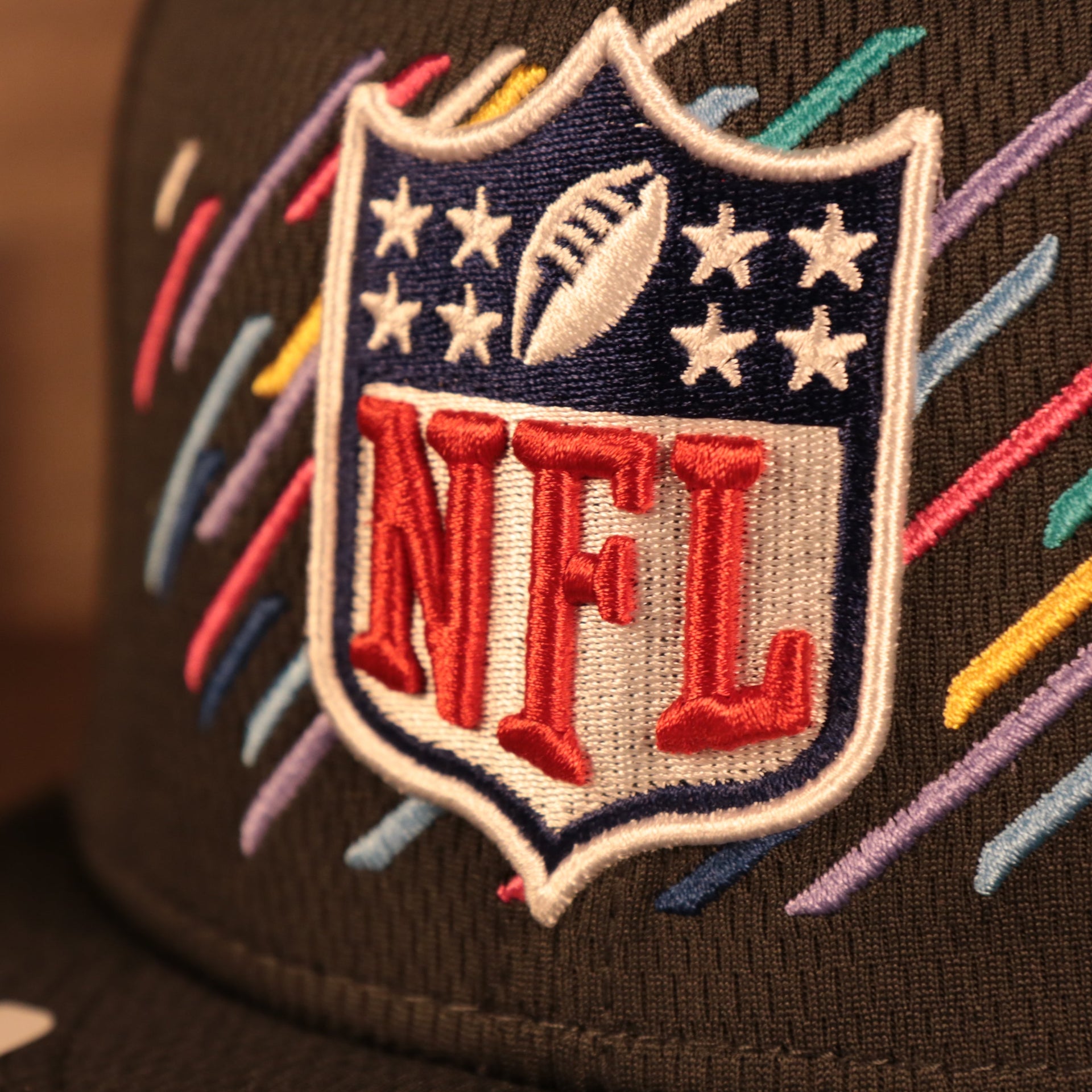 Zoomed in View of the NFL logo on this Cancer Awareness 9Fifty Snapback Cap
