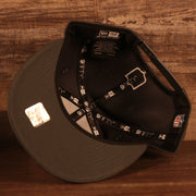 Dark gray under visor of the NFL Shield 2021 Crucial Catch Breast Cancer Awareness 9Fifty Snapback Hat