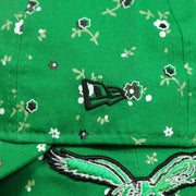 new era logo on the Philadelphia Eagles Ladies Throwback Logo Floral Bloom Micro Flower Pattern 9Twenty Dad Hat | Womens Floral Eagles Hat