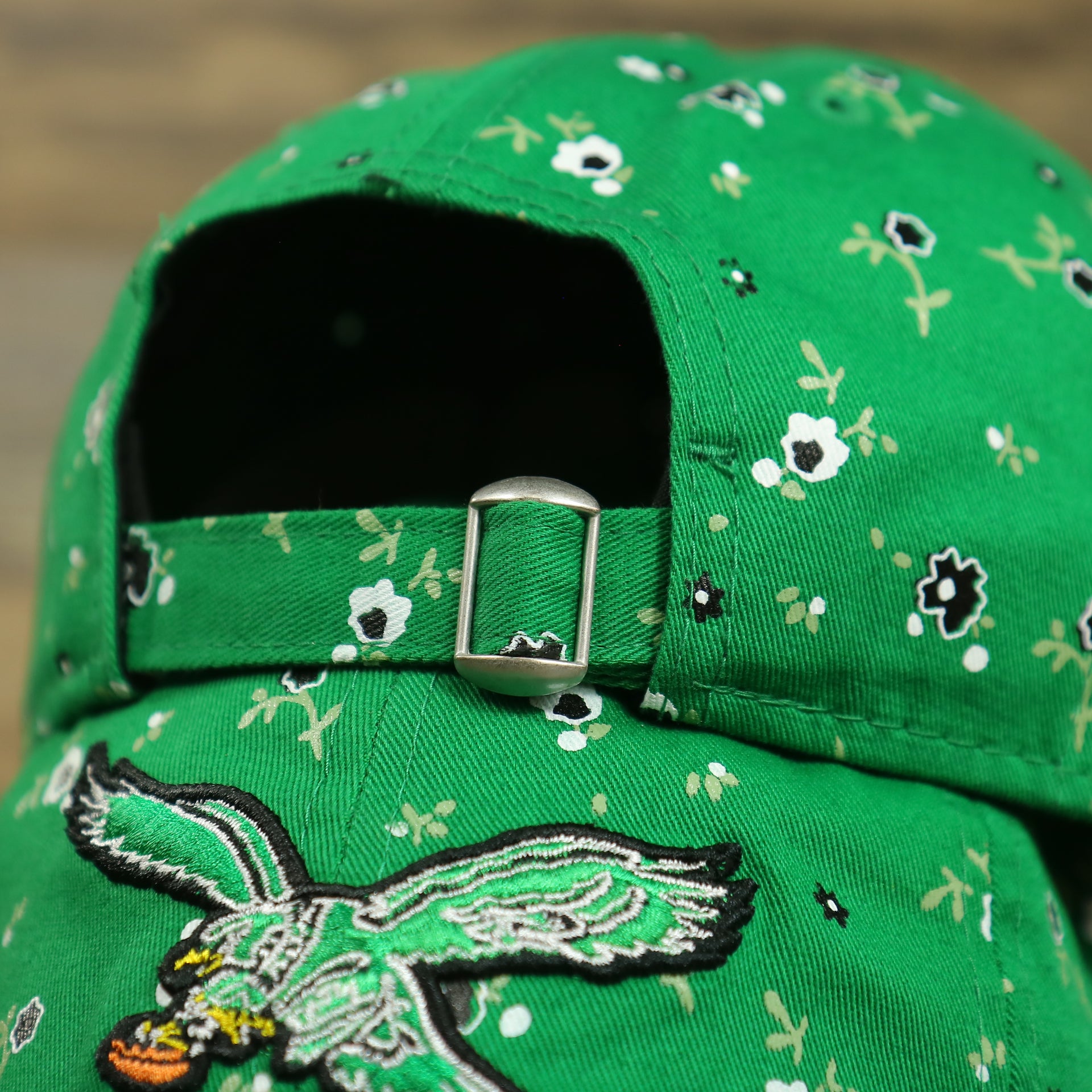 metallic buckle and adjustable strap on the Philadelphia Eagles Ladies Throwback Logo Floral Bloom Micro Flower Pattern 9Twenty Dad Hat | Womens Floral Eagles Hat