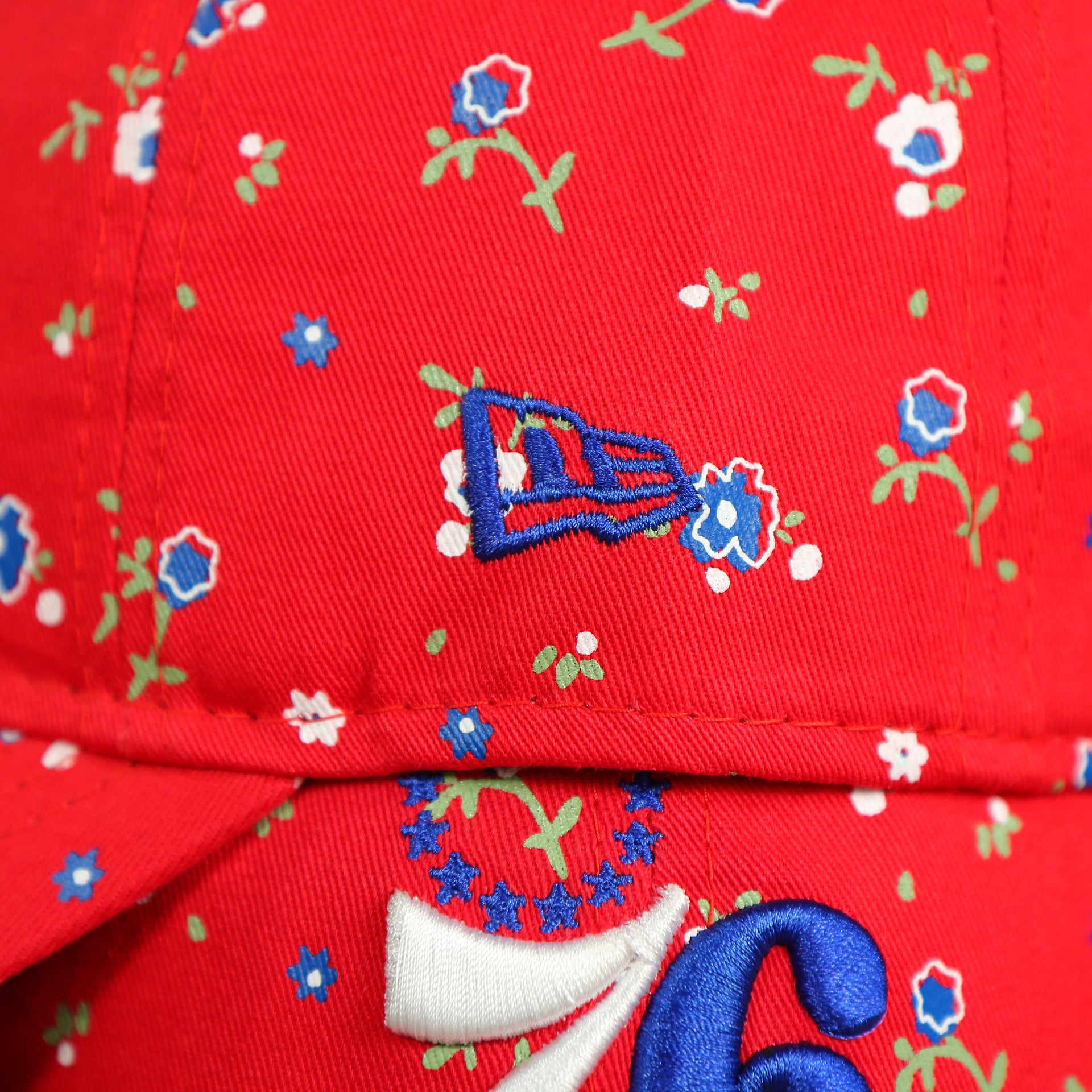 new era logo on the Philadelphia 76ers Ladies Floral Bloom Micro Flower Pattern 9Twenty Dad Hat | Womens Floral 76ers Hat