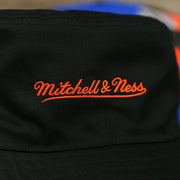 mitchell and ness logo on the New York Knicks 90s Inspired NBA Hyper Mitchell and Ness Reversible Bucket Hat