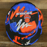 top side of the New York Knicks 90s Inspired NBA Hyper Mitchell and Ness Reversible Bucket Hat