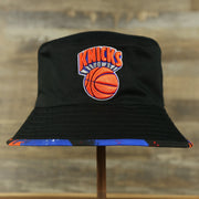 knicks logo on the New York Knicks 90s Inspired NBA Hyper Mitchell and Ness Reversible Bucket Hat