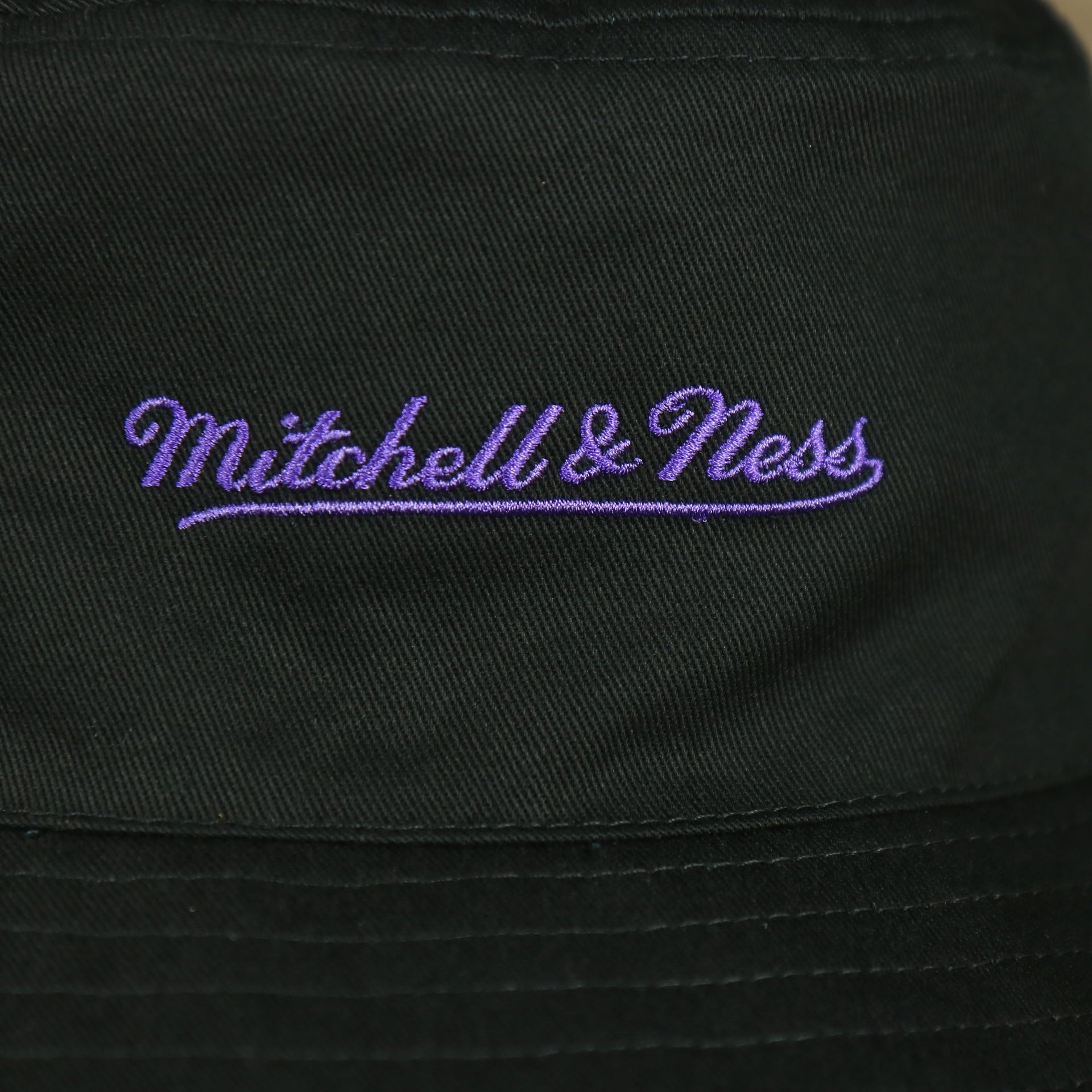 mitchell and ness logo on the Los Angeles Lakers 90s Inspired NBA Hyper Mitchell and Ness Reversible Bucket Hat
