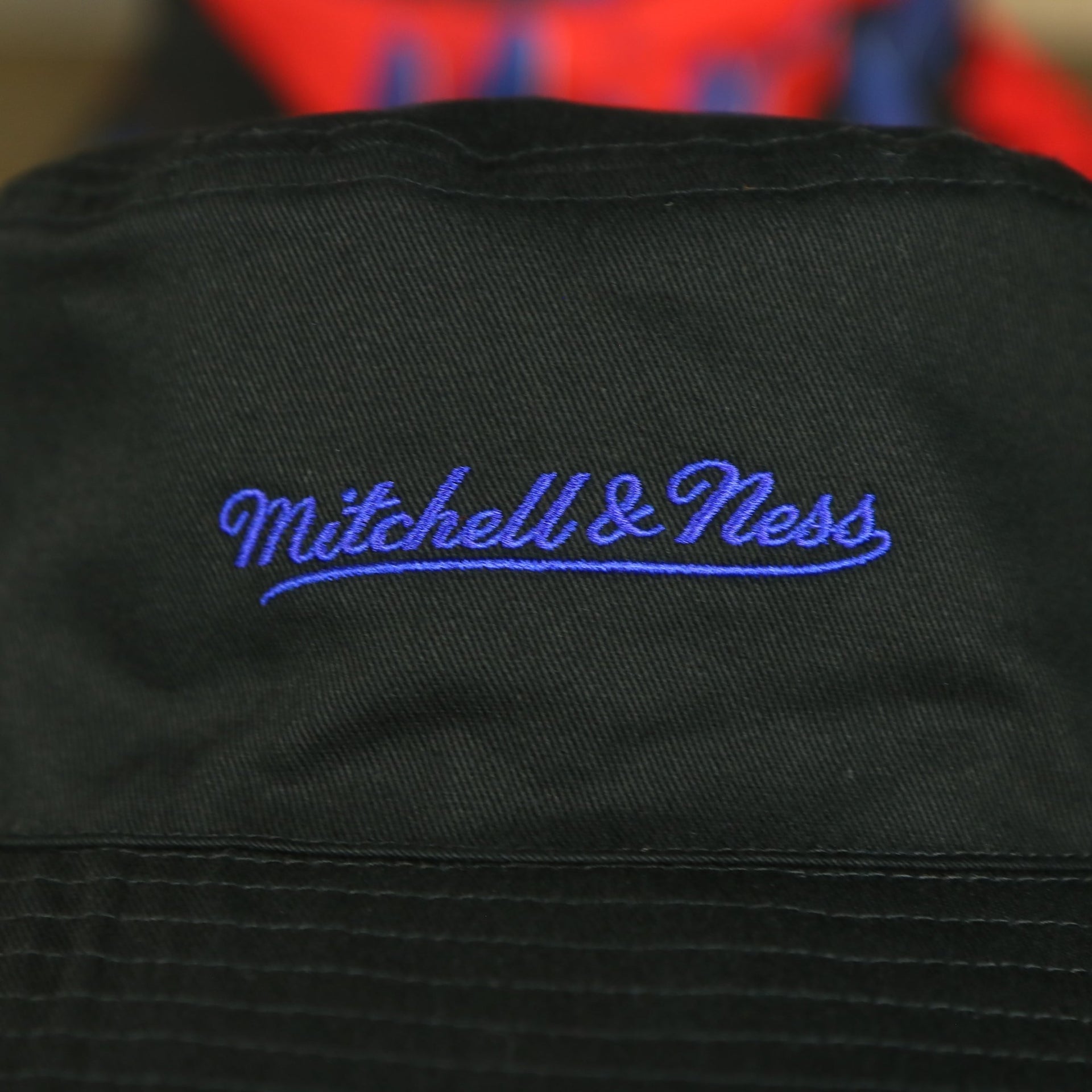 mitchell and ness logo on the Philadelphia 76ers 90s Inspired NBA Hyper Mitchell and Ness Reversible Bucket Hat