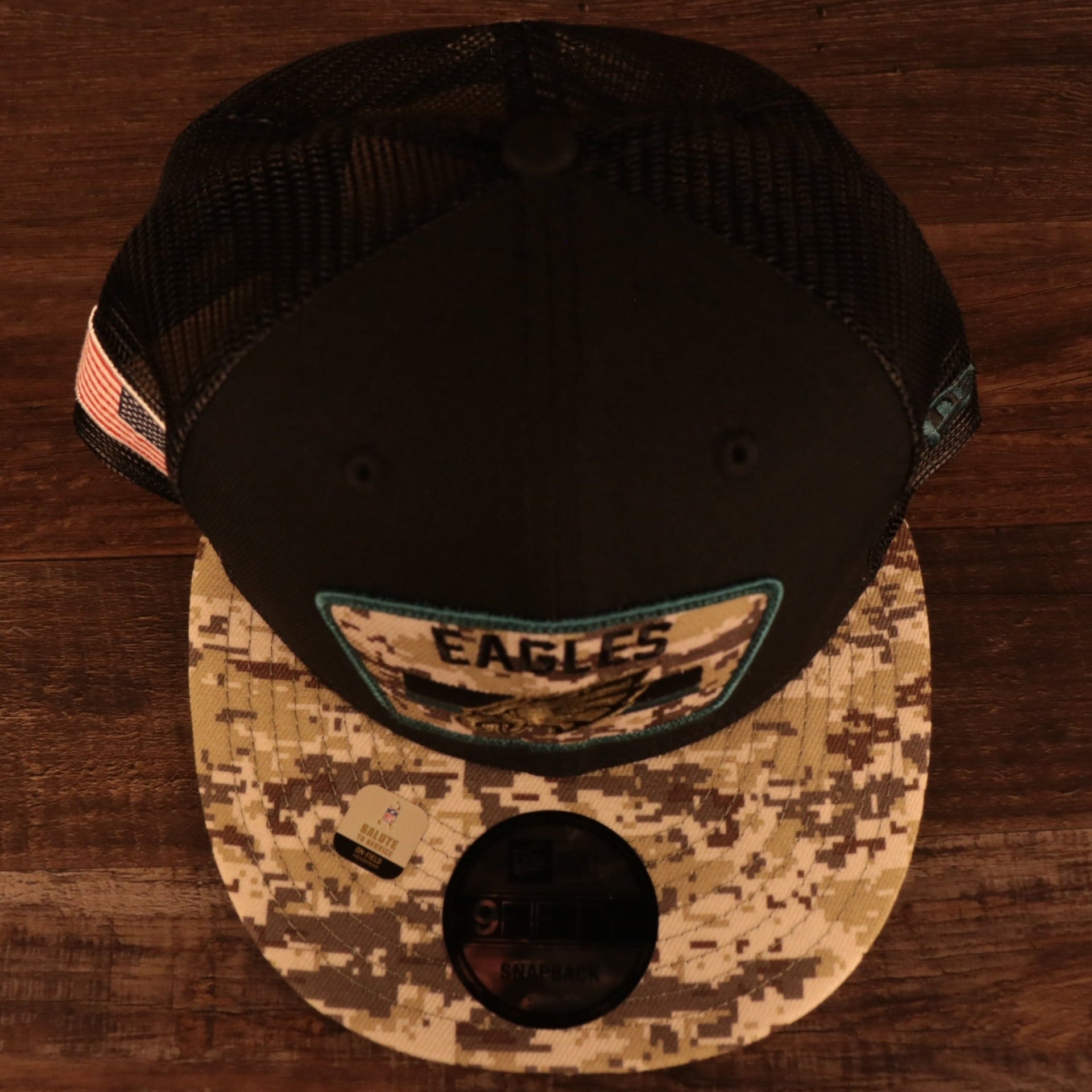 Top down view of the Philadelphia Eagles 2021 Salute To Service On Field Sideline 9Fifty Snapback Trucker Hat