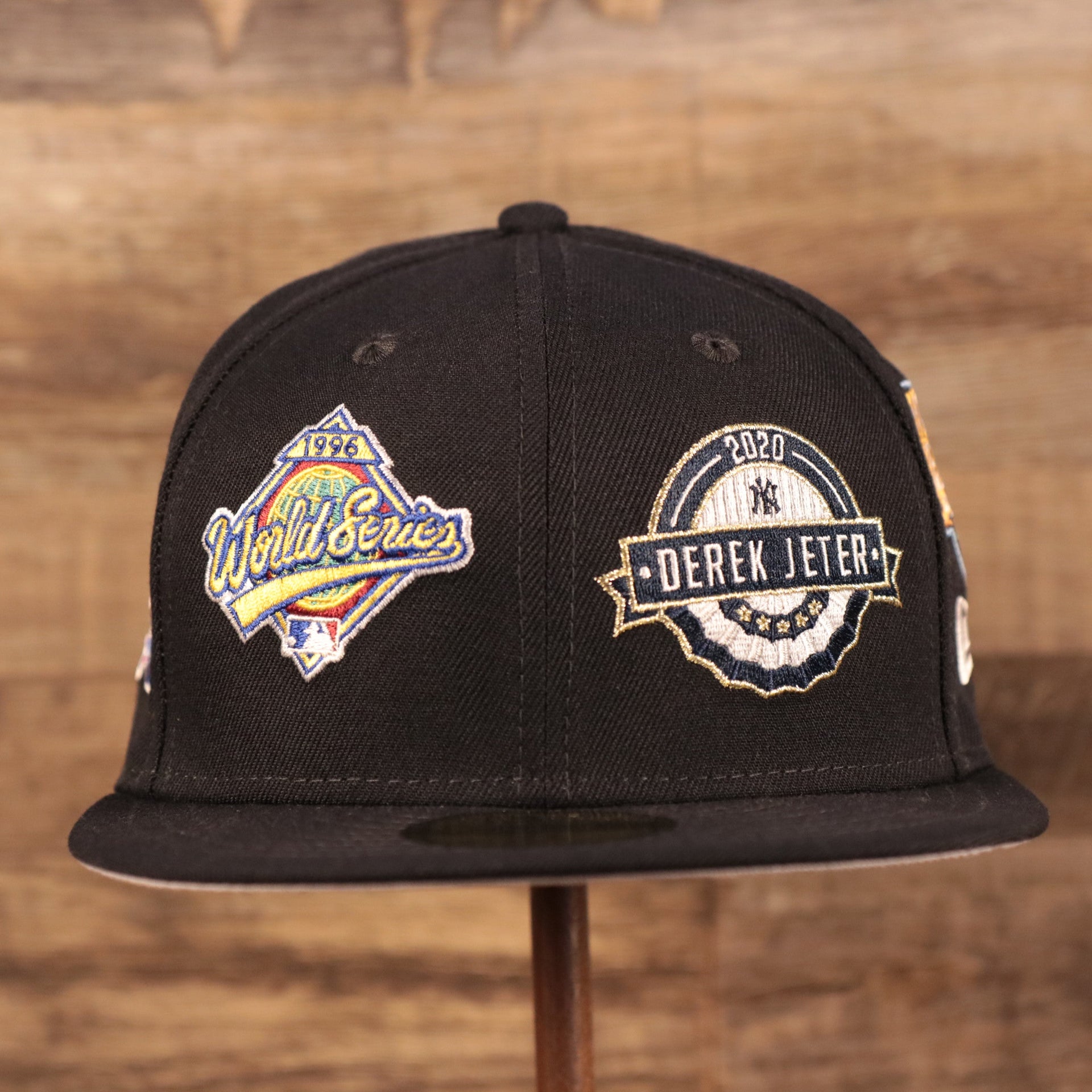 Embroidered on the front two panels of the New York Yankees Derek Jeter 59Fifty Fitted Cap is the 1996 World Series Patch and the 2020 Derek Jeter Patch