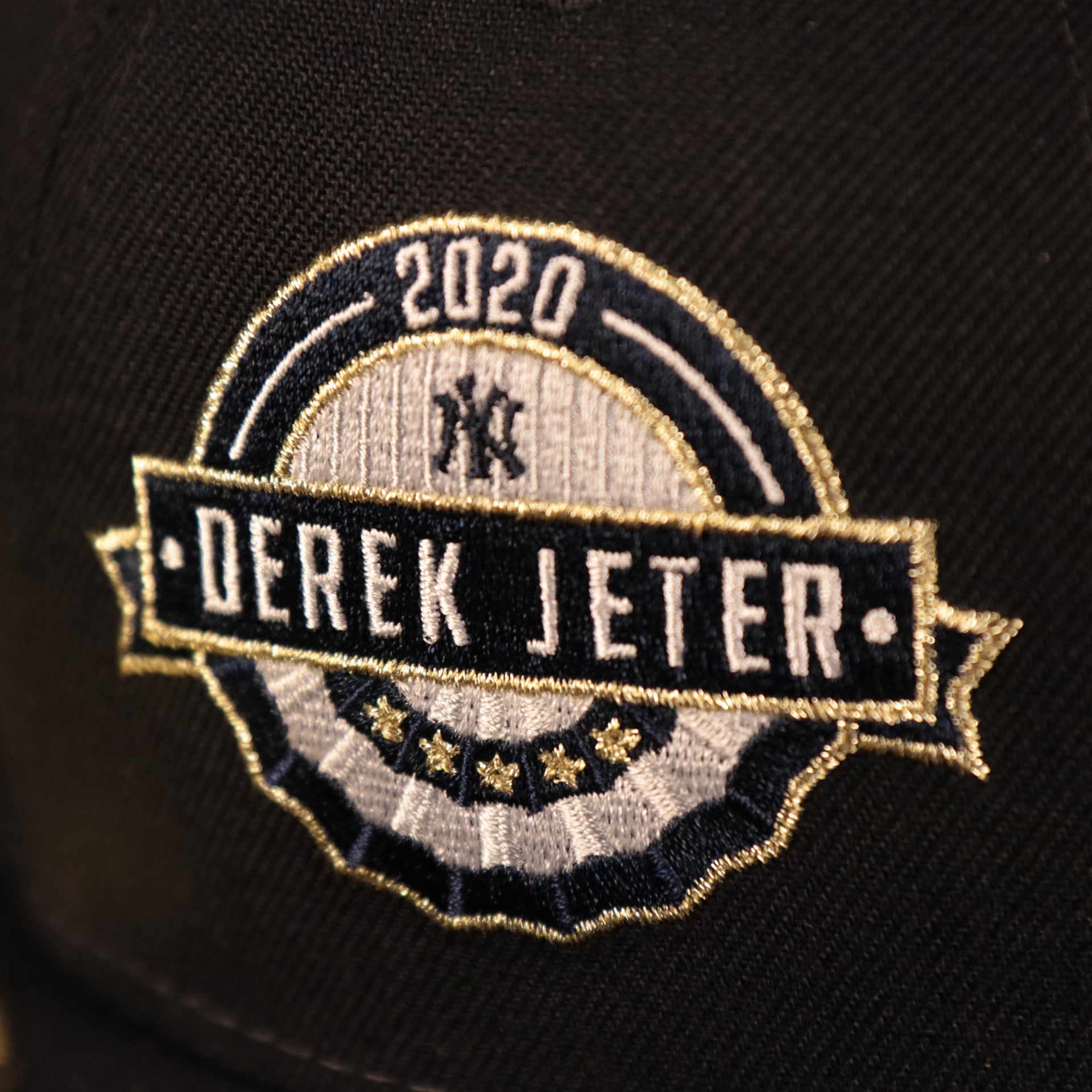 A close up of the 2020 Derek Jeter patch embroidered on the New York Yankees Derek Jeter All Over World Series Side Patch 59Fifty Fitted Cap