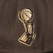 A close up of the Larry O'Brien trophy embroidered in metallic gold and black, on the wearer's right side of the Milwaukee Bucks 2021 NBA Champ Hat