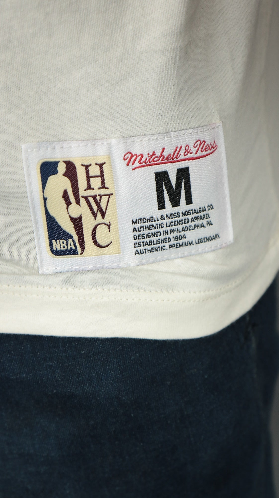 nba label on the Philadelphia 76ers Liberty Bell logo Hardwood Classics Color Blocked Tee | Royal/Cream T-Shirt
