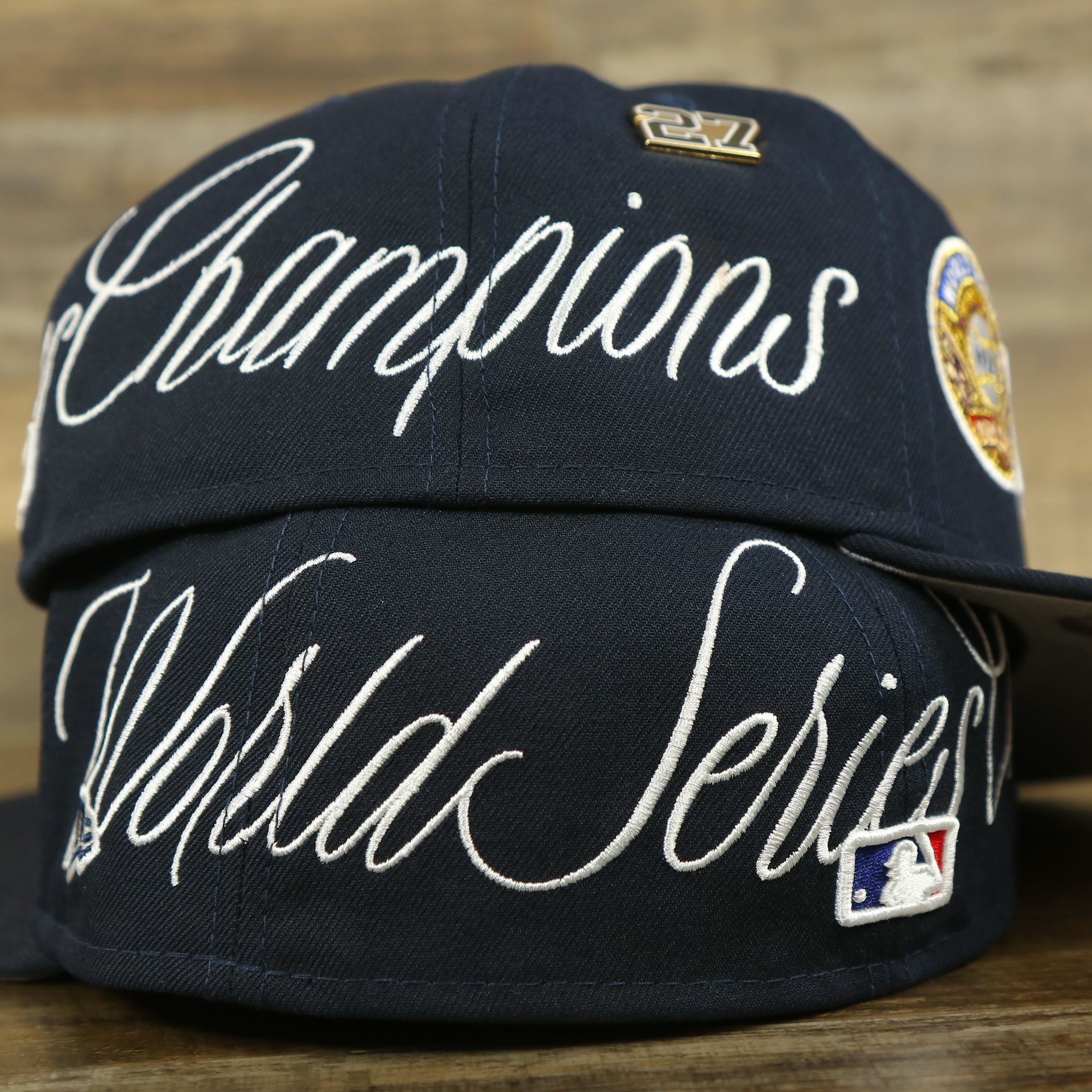 right and left wearer's side of the New York Yankees Cooperstown All Over Side Patch "Historic Champs" Gray UV 59Fifty Fitted Cap | Navy 59Fifty Fitted Cap