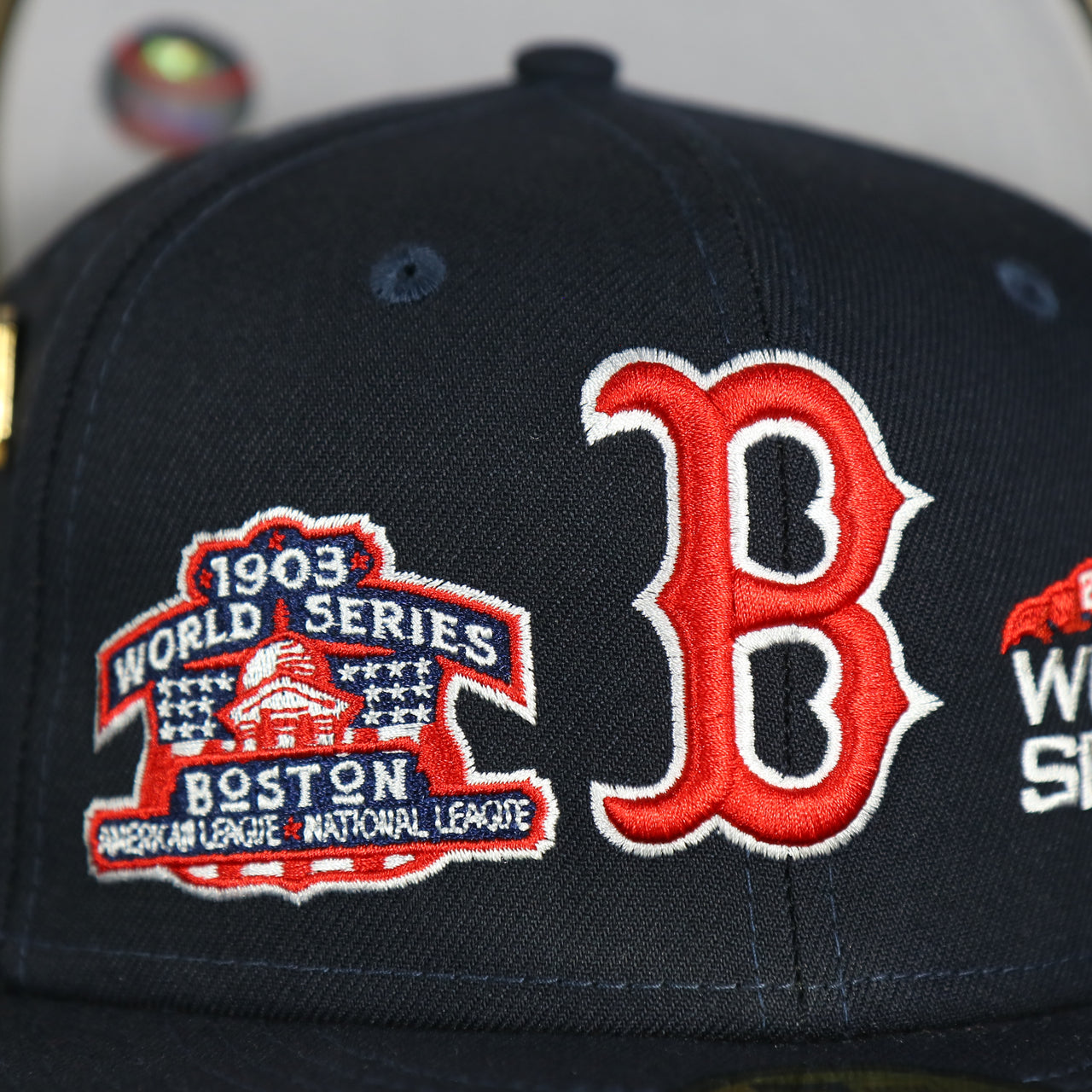 1903 world series patch and red sox logo on the Boston Red Sox Cooperstown All Over Side Patch "Historic Champs" Gray UV 59Fifty Fitted Cap | Navy 59Fifty Fitted Cap