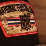 Close up of front patch logo on the NFL Shield 2021 Salute To Service On Field Sideline 9Fifty Snapback Trucker Hat