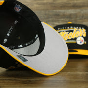 gray under visor of the Pittsburgh Steelers "Team Script" College Bar 9Fifty Snapback Hat | Black/Yellow Steelers 950 Snap Cap
