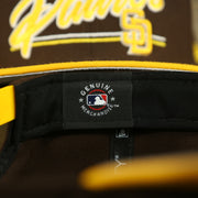 MLB label on the San Diego Padres "Team Script" College Bar 9Fifty Snapback Hat | Brown/Yellow Steelers 950 Snap Cap