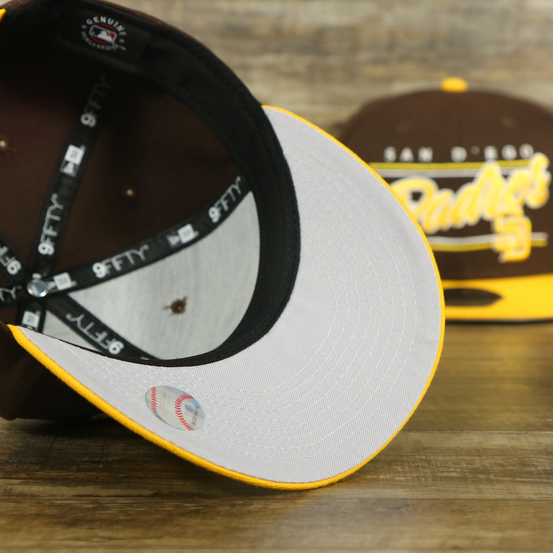 gray under visor of the San Diego Padres "Team Script" College Bar 9Fifty Snapback Hat | Brown/Yellow Steelers 950 Snap Cap