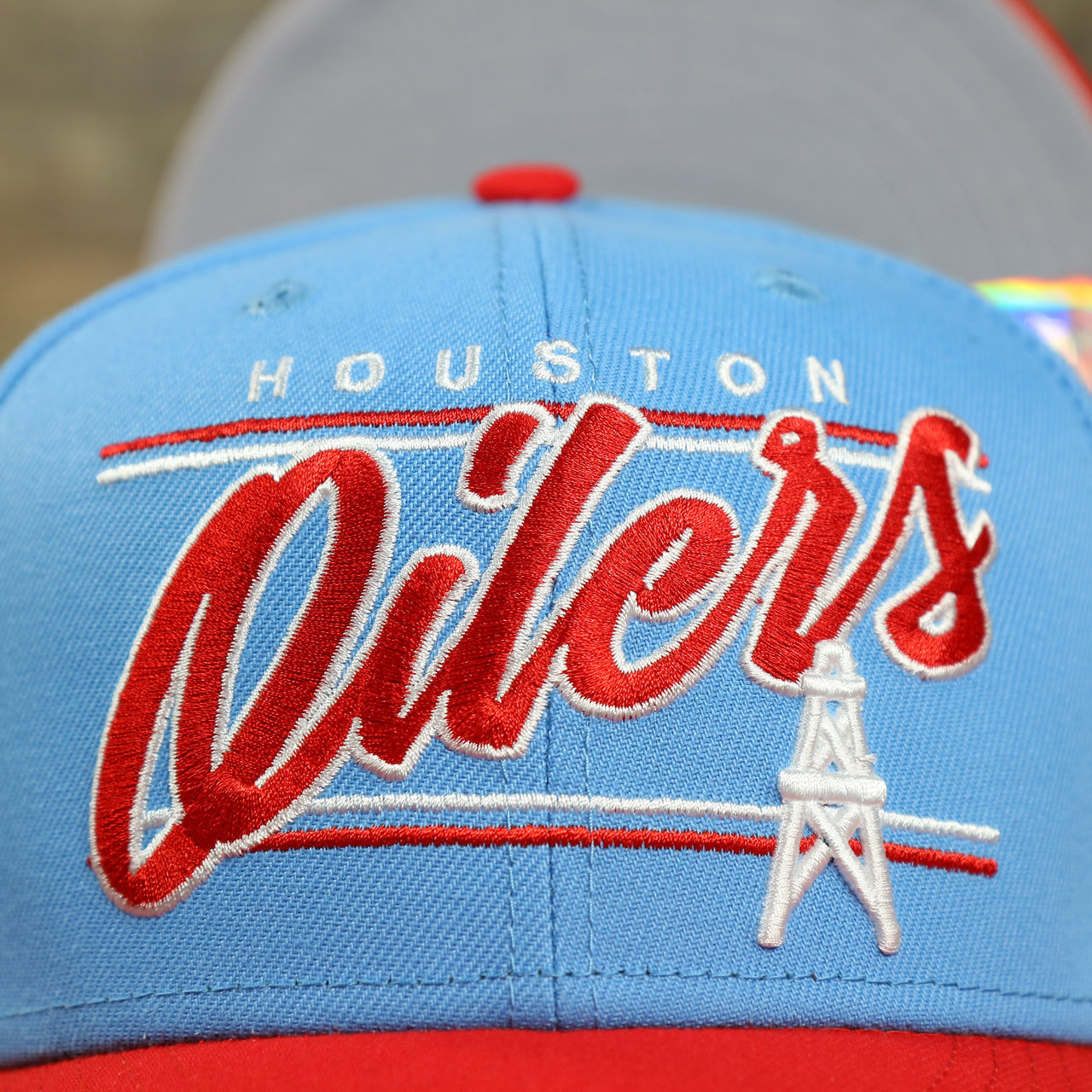 oilers logo on the Houston Oilers Vintage "Team Script" College Bar Gray UV 9Fifty Snapback | Light Blue/Rd 9Fifty Snapback Hat