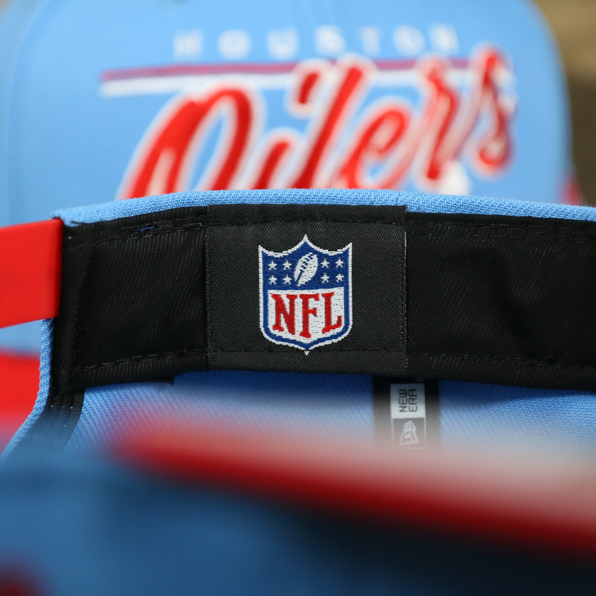 NFL label on the Houston Oilers Vintage "Team Script" College Bar Gray UV 9Fifty Snapback | Light Blue/Rd 9Fifty Snapback Hat