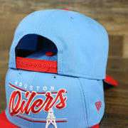 red adjustable snap on the Houston Oilers Vintage "Team Script" College Bar Gray UV 9Fifty Snapback | Light Blue/Rd 9Fifty Snapback Hat