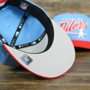 gray under visor of the Houston Oilers Vintage "Team Script" College Bar Gray UV 9Fifty Snapback | Light Blue/Rd 9Fifty Snapback Hat