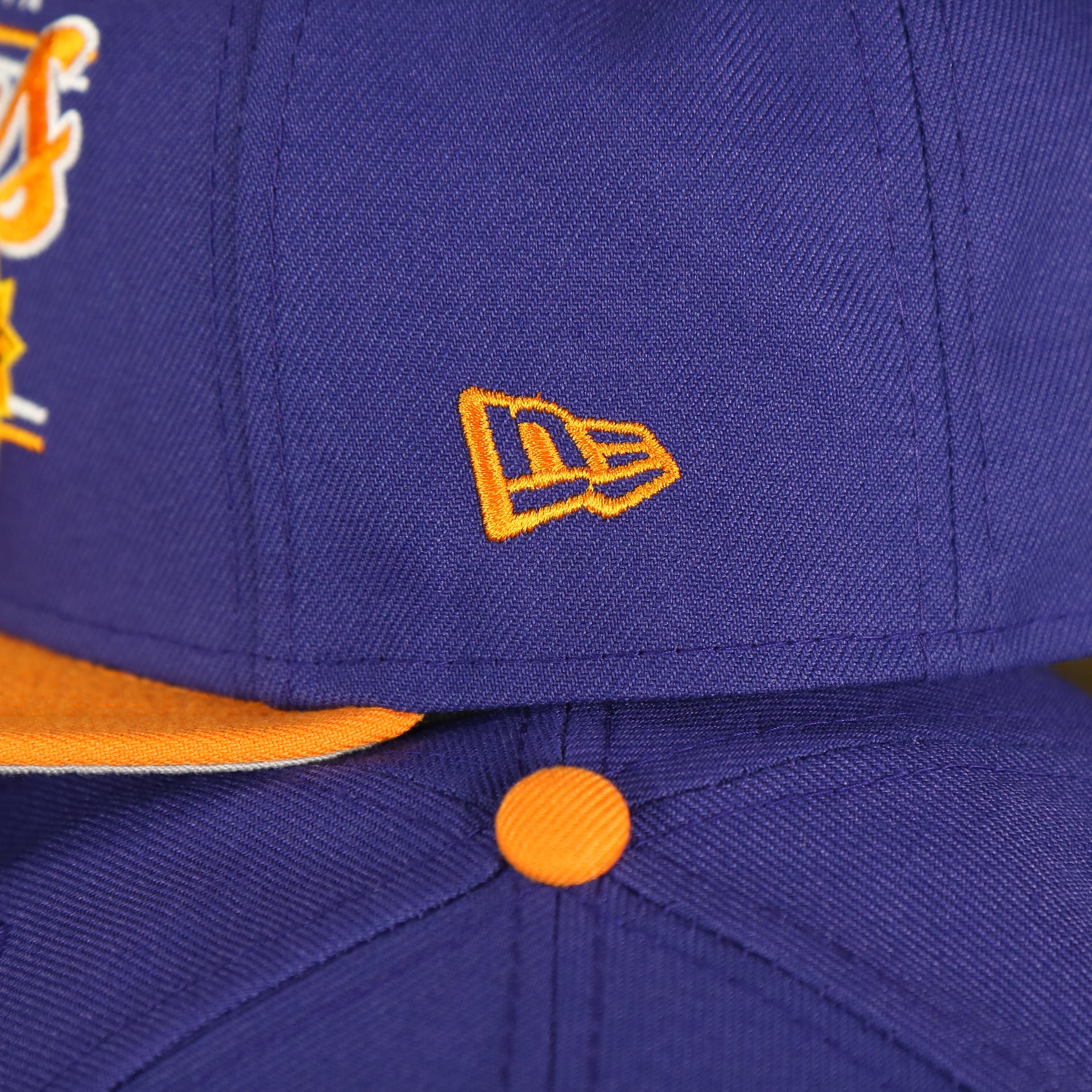 new era logo on the Phoenix Suns Team Script College Bar 9Fifty Snapback Hat | Purple/Orange Suns 950 Snap Cap