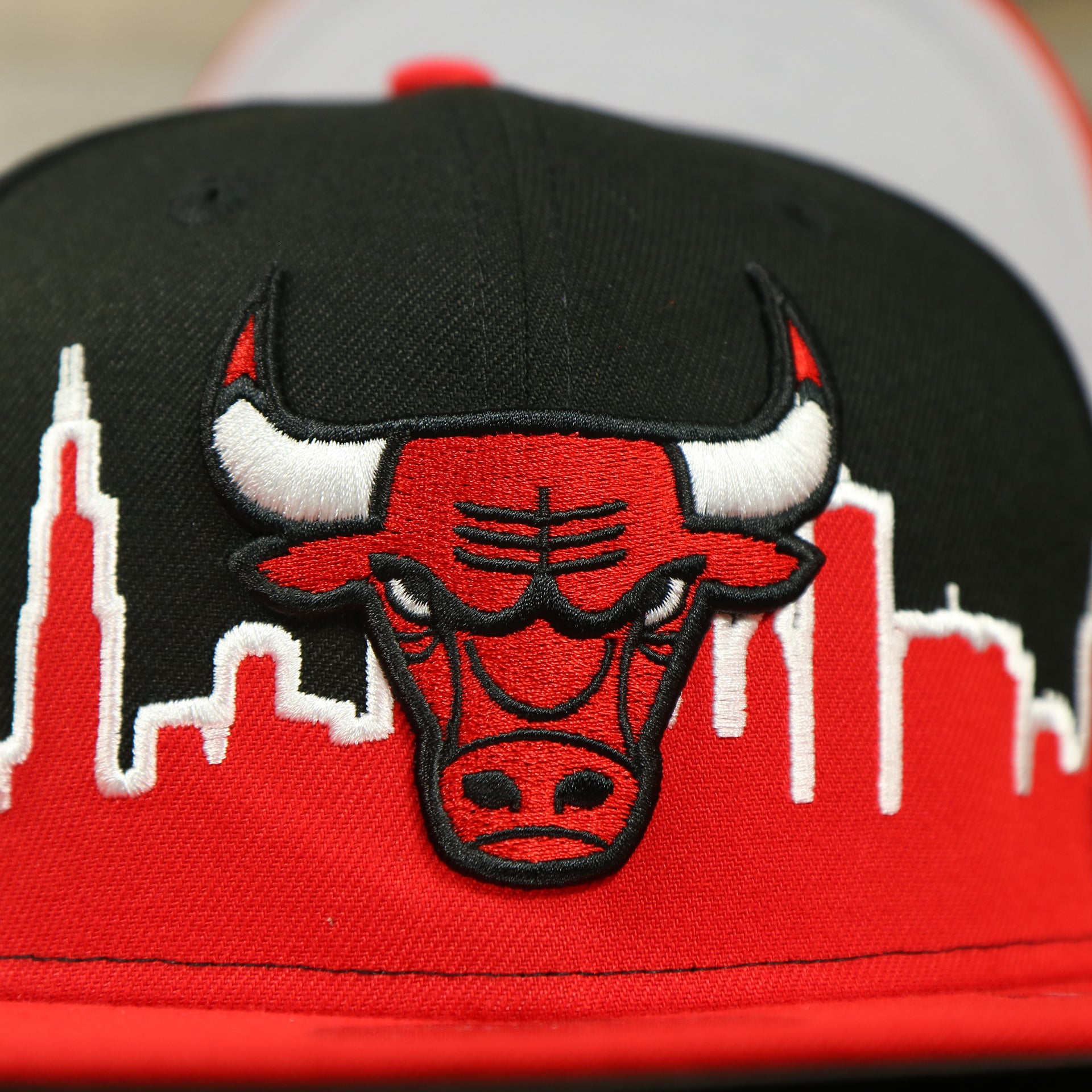 bulls logo on the Chicago Bulls City Skyline Side Patch 9Fifty Snapback Hat | Chicago Skyline 950