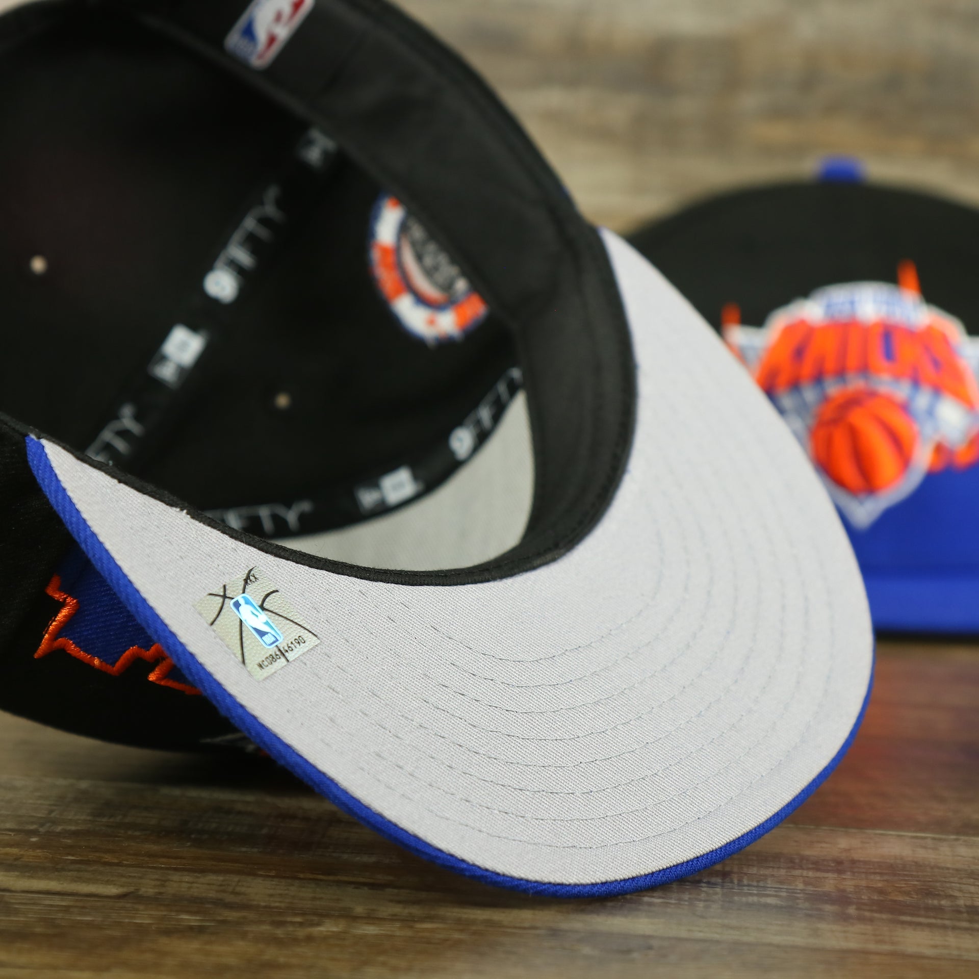 grey under visor on the New York Knicks City Skyline Side Patch 9Fifty Snapback Hat | New York Skyline 950