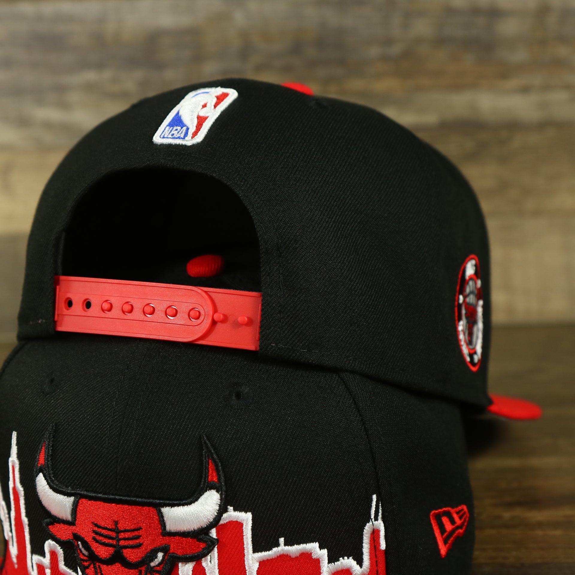 red adjustable snap on the Chicago Bulls City Skyline Side Patch 9Fifty Snapback Hat | Chicago Skyline 950
