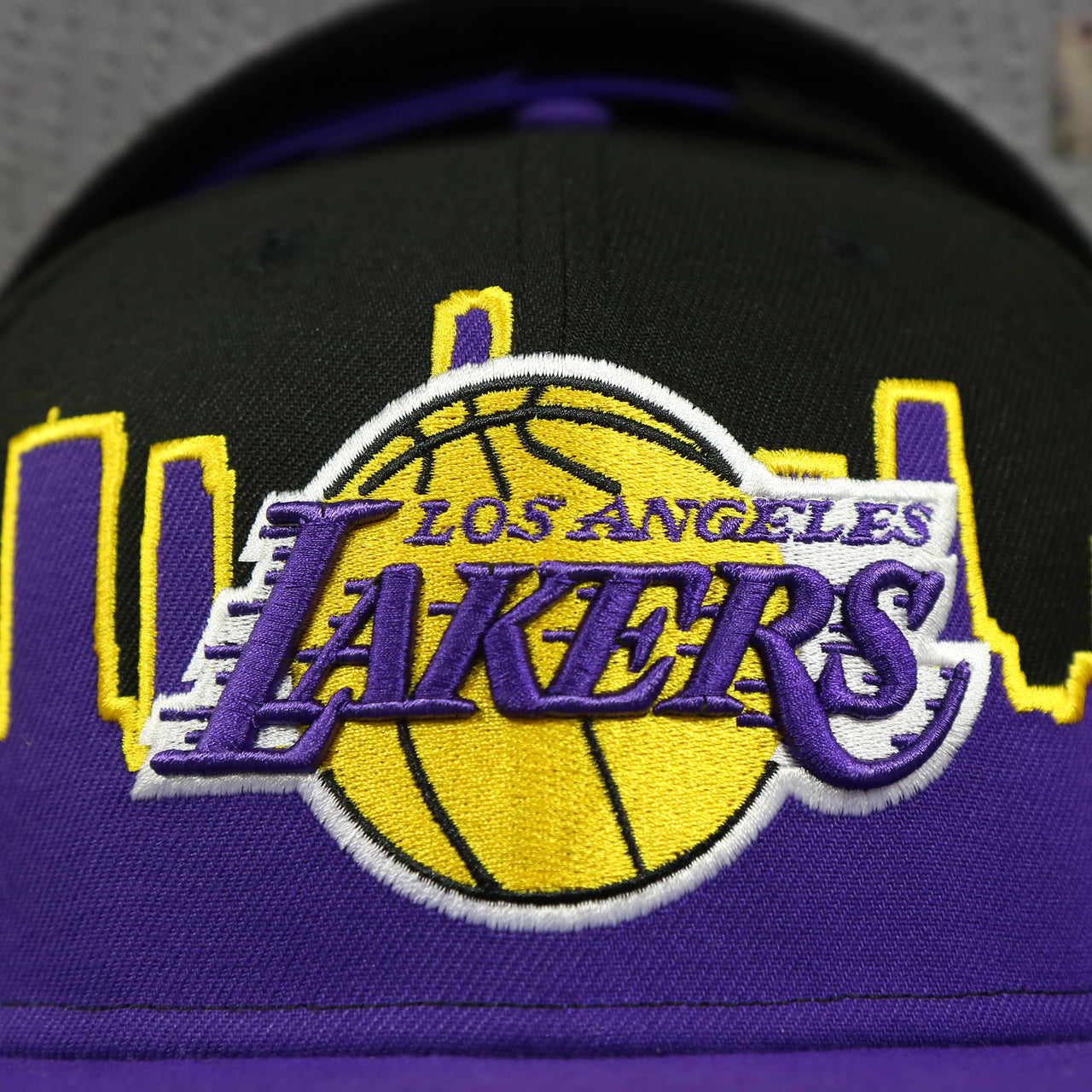 lakers logo on the Los Angeles Lakers City Skyline Side Patch 9Fifty Snapback Hat | Los Angeles Skyline 950