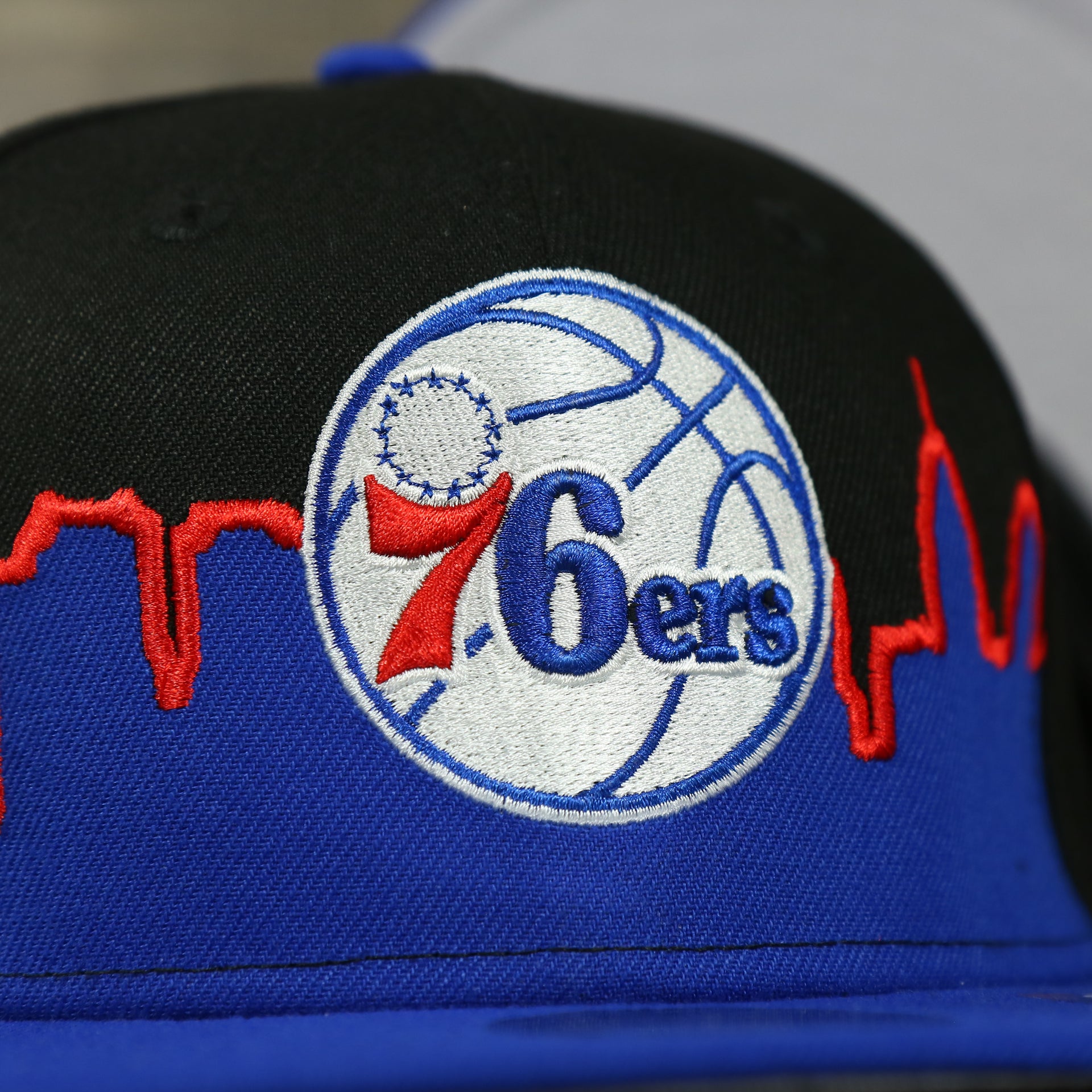 76ers logo on the Philadelphia 76ers Skyline Side Patch 9Fifty Youth Snapback Hat | Philadelphia Skyline 950
