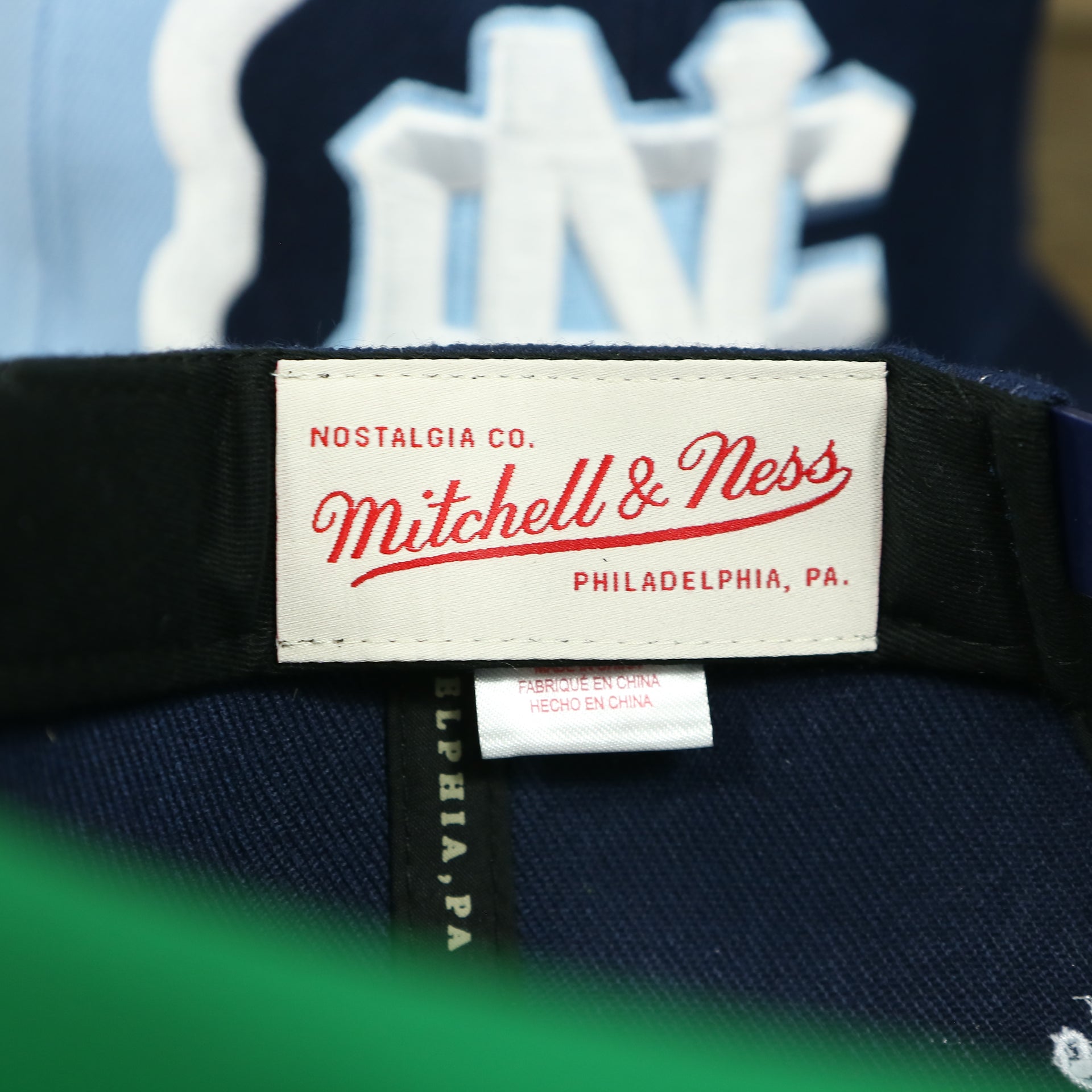 mitchell and ness label on the University of North Carolina Tar Heels Retroline Logo Outline Vintage Snapback Hat | Mitchell and Ness Tar Heels Snap Cap