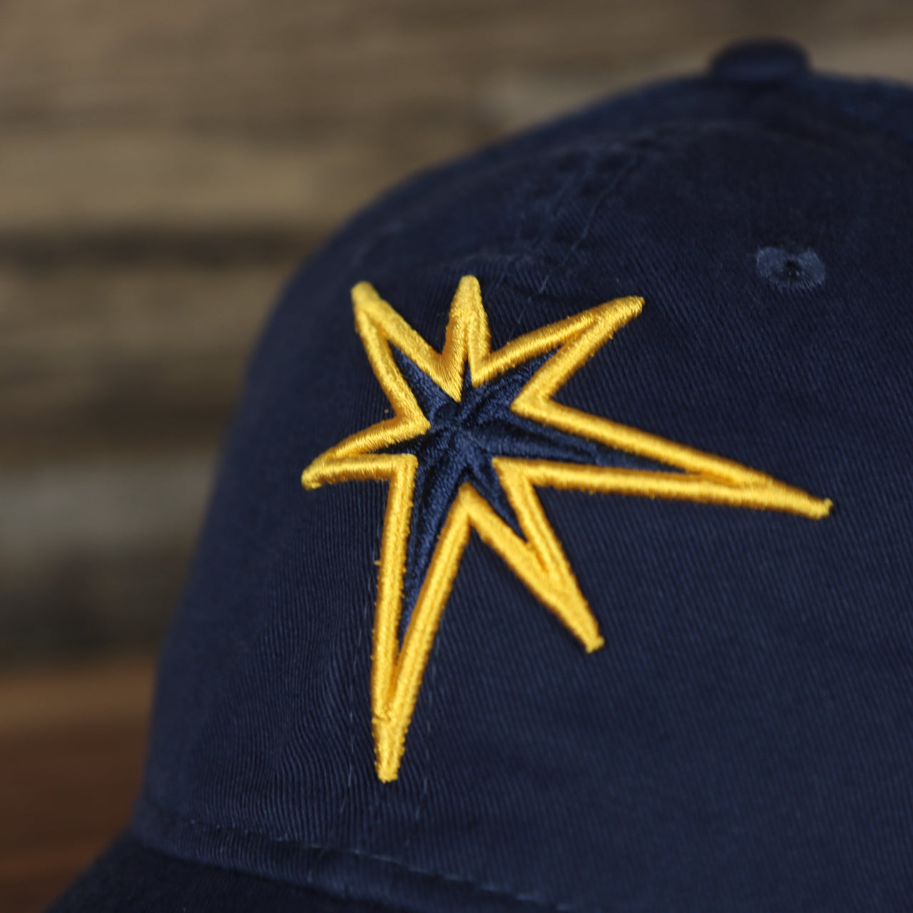 Close up of the front logo on the Tampa Bay Rays 2022 MLB Batting Practice 9Twenty Trucker Dad Hat