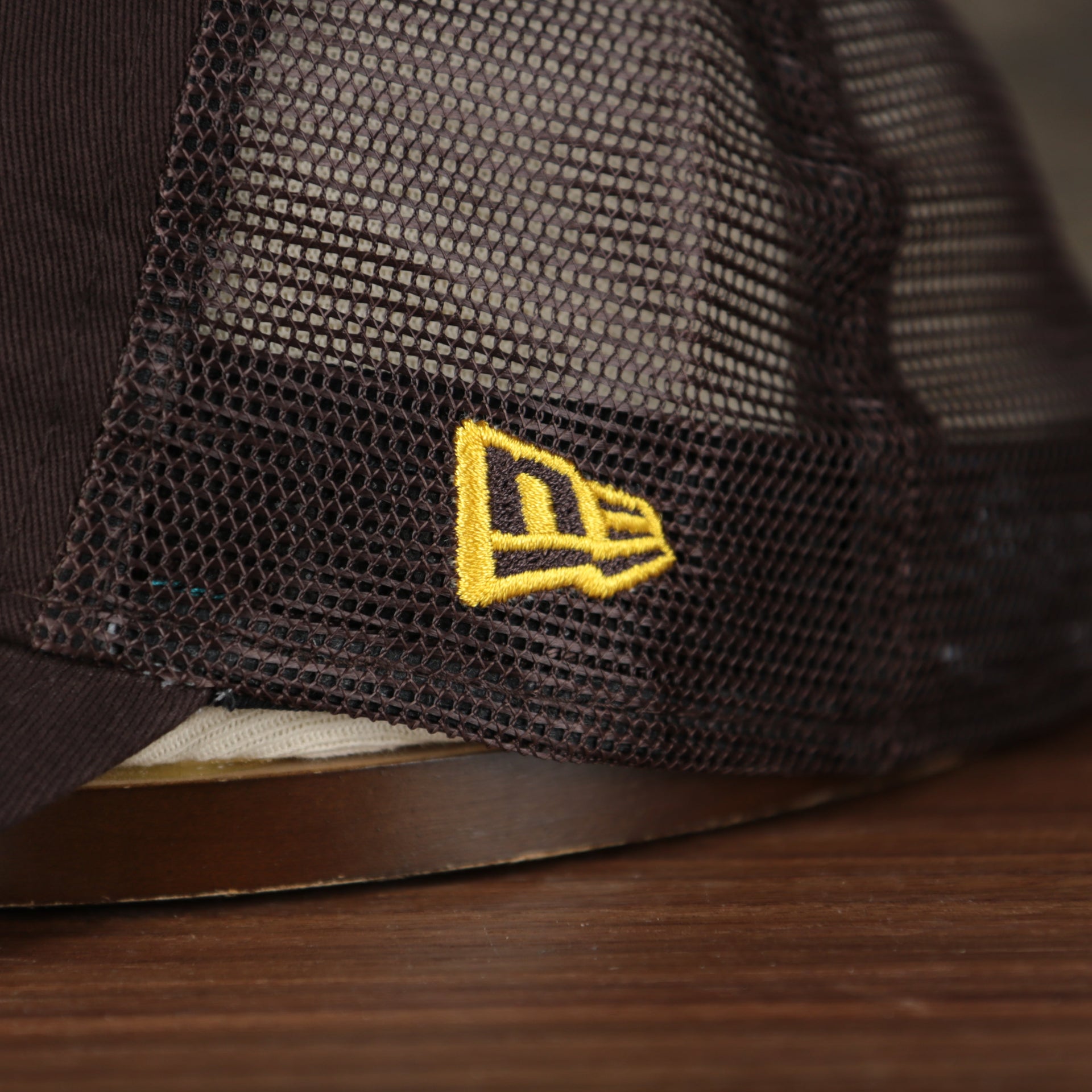 Close up of the New Era logo on the wearer's left of the San Diego Padres 2022 MLB Batting Practice 9Twenty Trucker Dad Hat