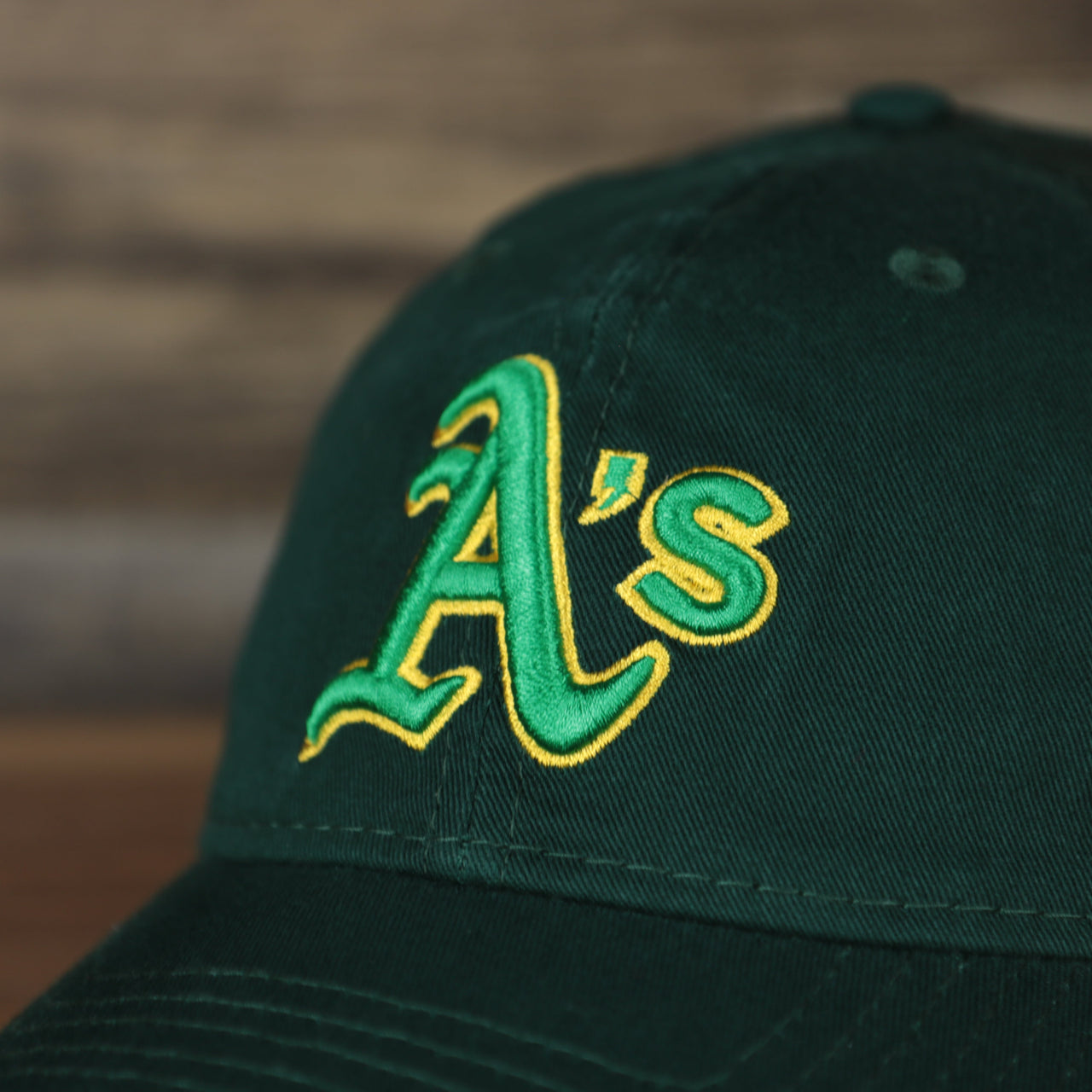 Close up of the front logo on the Oakland Athletics 2022 MLB Batting Practice On-Field Spring Training 9Twenty Trucker Dad Hat
