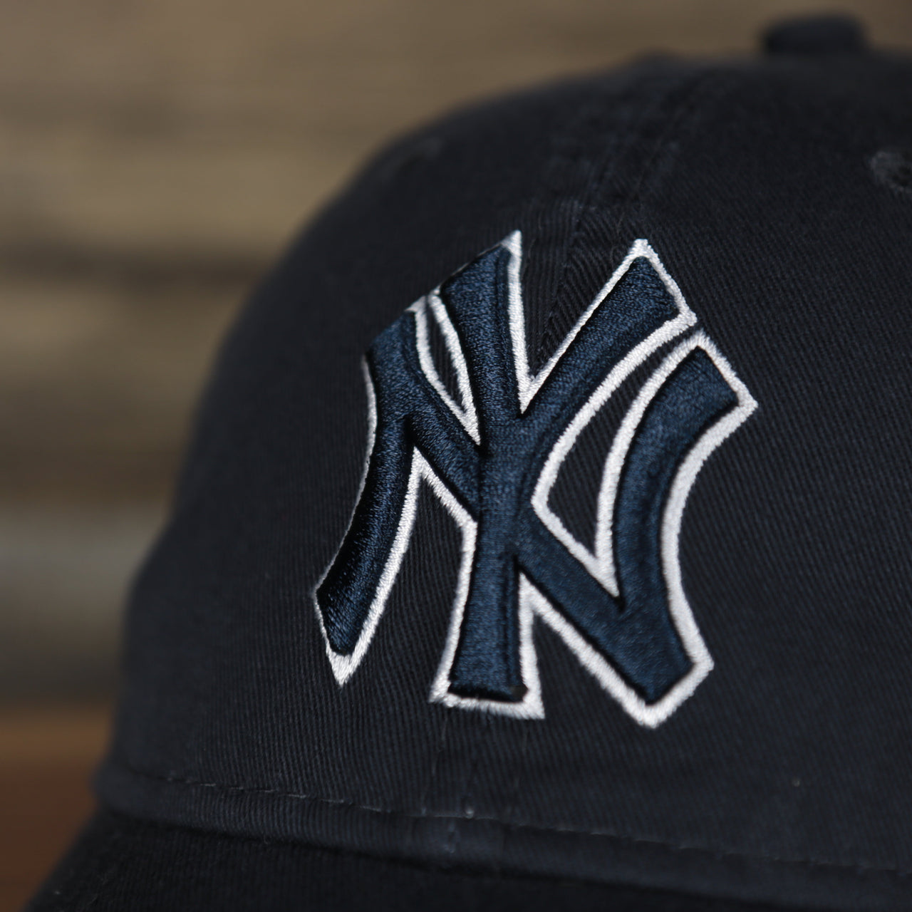 Close up of the New York Yankees logo on the New York Yankees 2022 MLB Batting Practice On-Field Spring Training 9Twenty Trucker Dad Hat